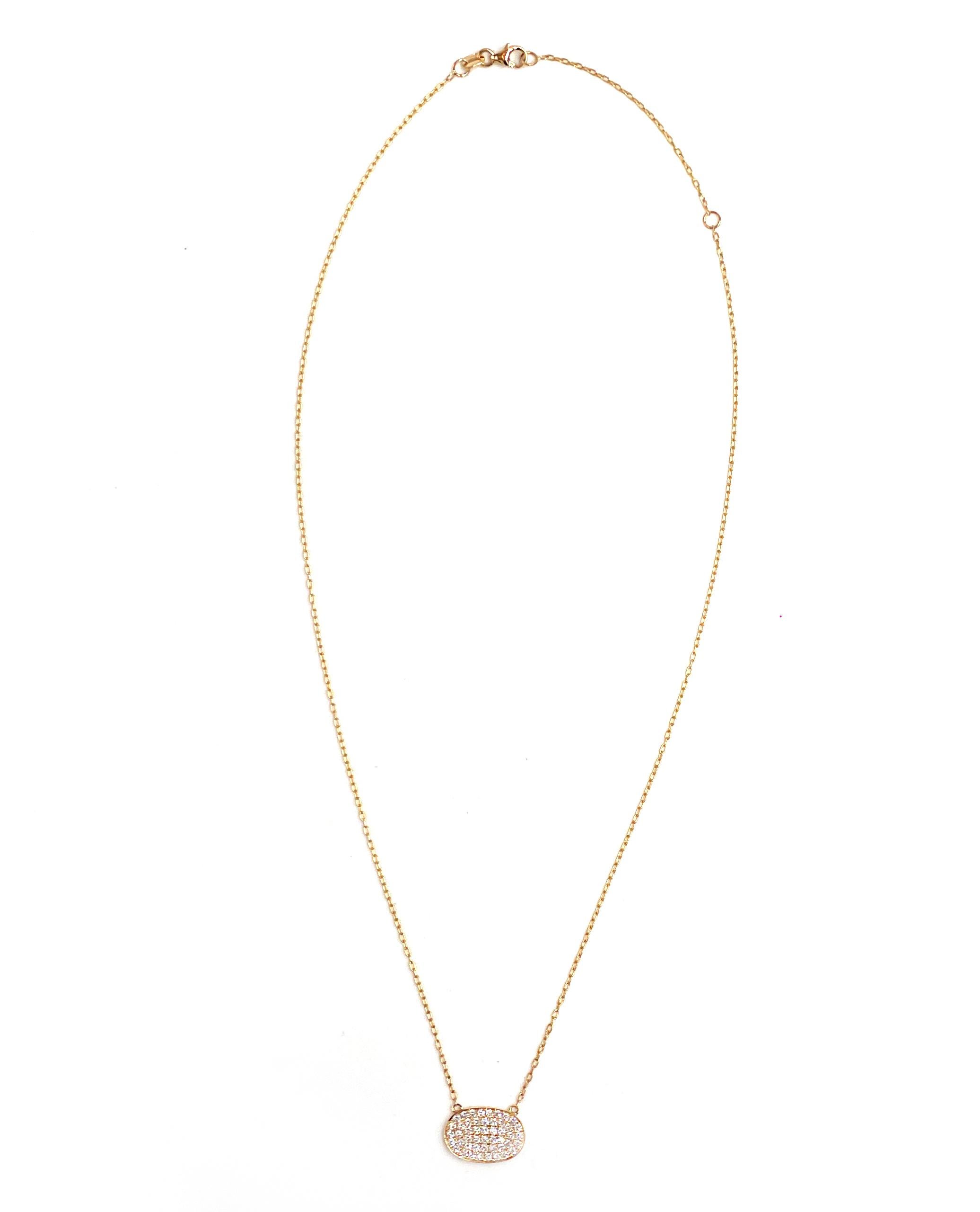 Contemporary Oval Pendant Necklace with Pavé Diamonds Set in 18K Yellow Gold For Sale