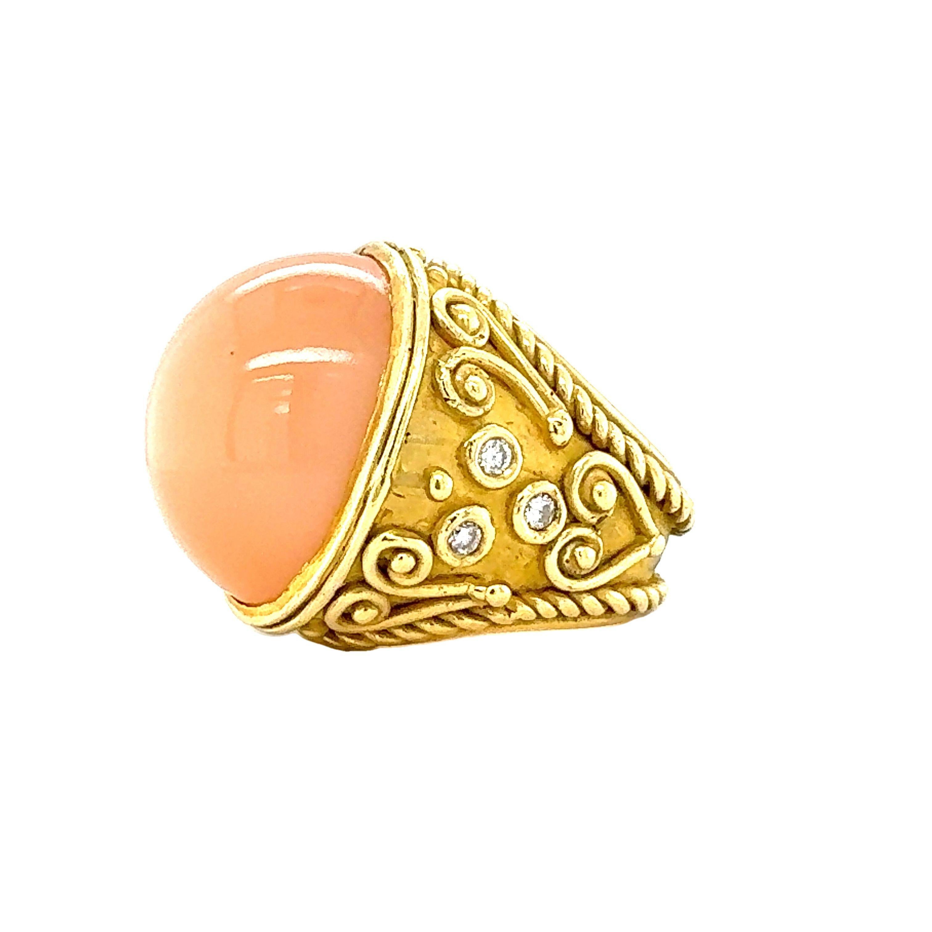 This bold and sophisticated 18K yellow gold ring from the 1970s showcases a magnificent peach moonstone as its centerpiece. The oval cabochon moonstone, weighing an impressive 44 carats, exhibits a soft, glowing luster that exudes elegance and