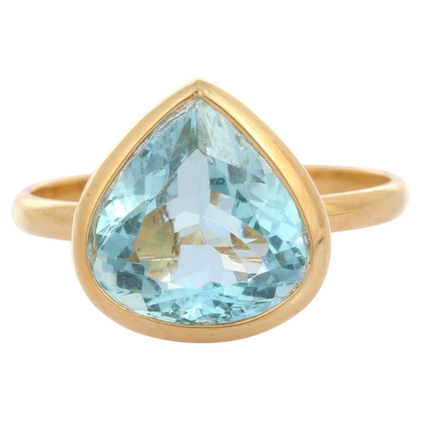 For Sale:  18K Yellow Gold Pear Cut Aquamarine Solitaire Ring