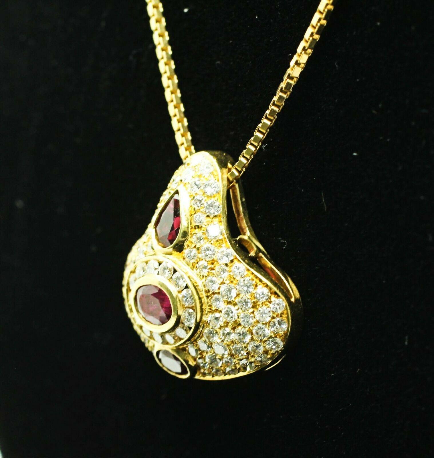 Contemporary 18 Karat Yellow Gold Pear-Shaped and Oval Ruby and Diamond Pendant