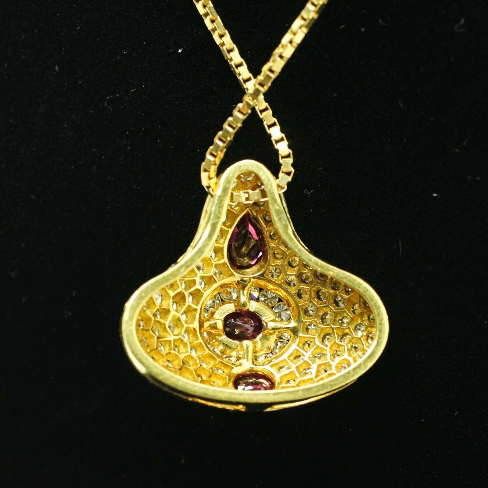 Oval Cut 18 Karat Yellow Gold Pear-Shaped and Oval Ruby and Diamond Pendant