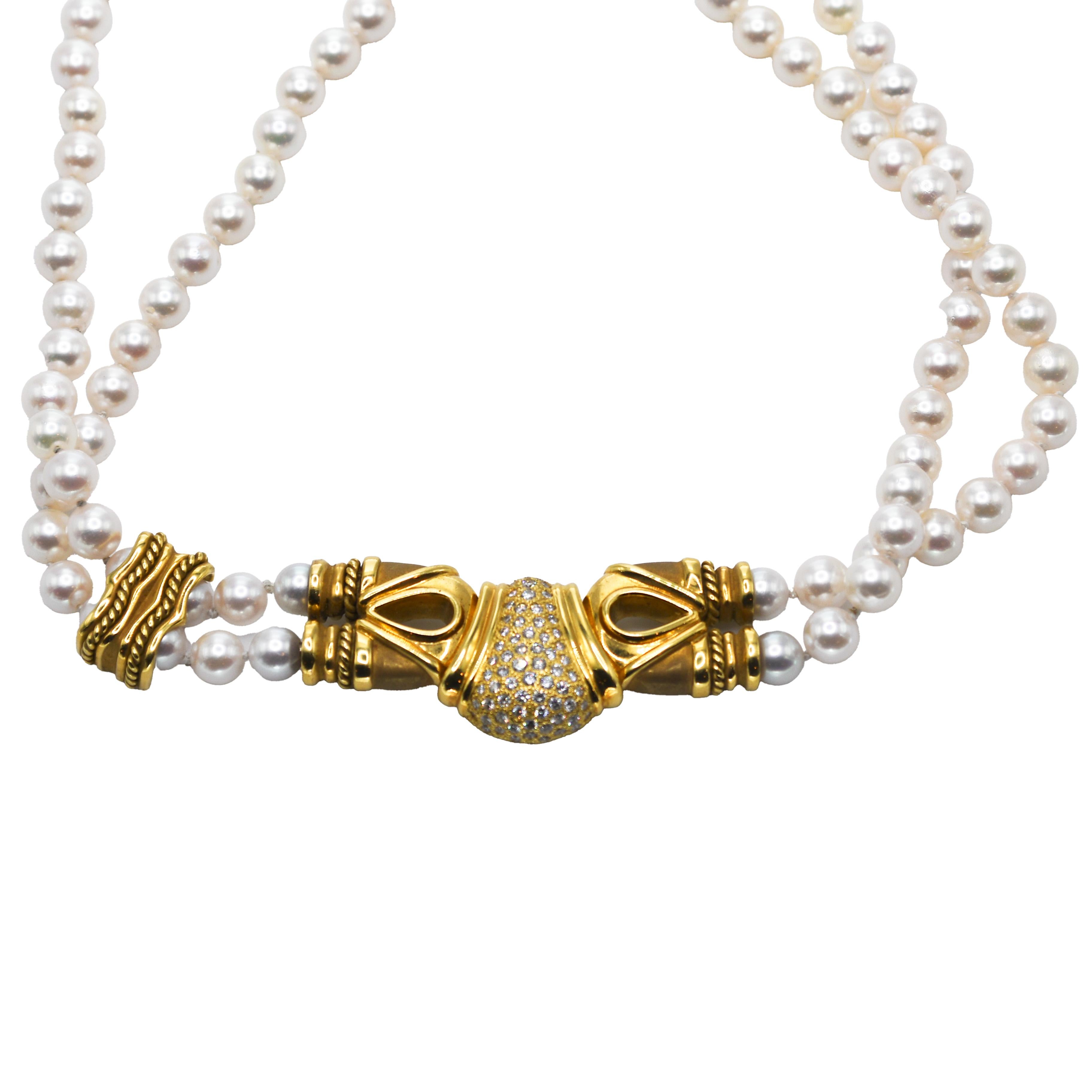 Ladies' custom-made 18k yellow gold and pearl necklace with diamonds.
Stampded 18k and weighs 94.3 grams gross weight, 54 grams of 18k gold without the pearls.
The pendant/clasp is set with round brilliant cut diamonds, 1.00 total carats, G to H