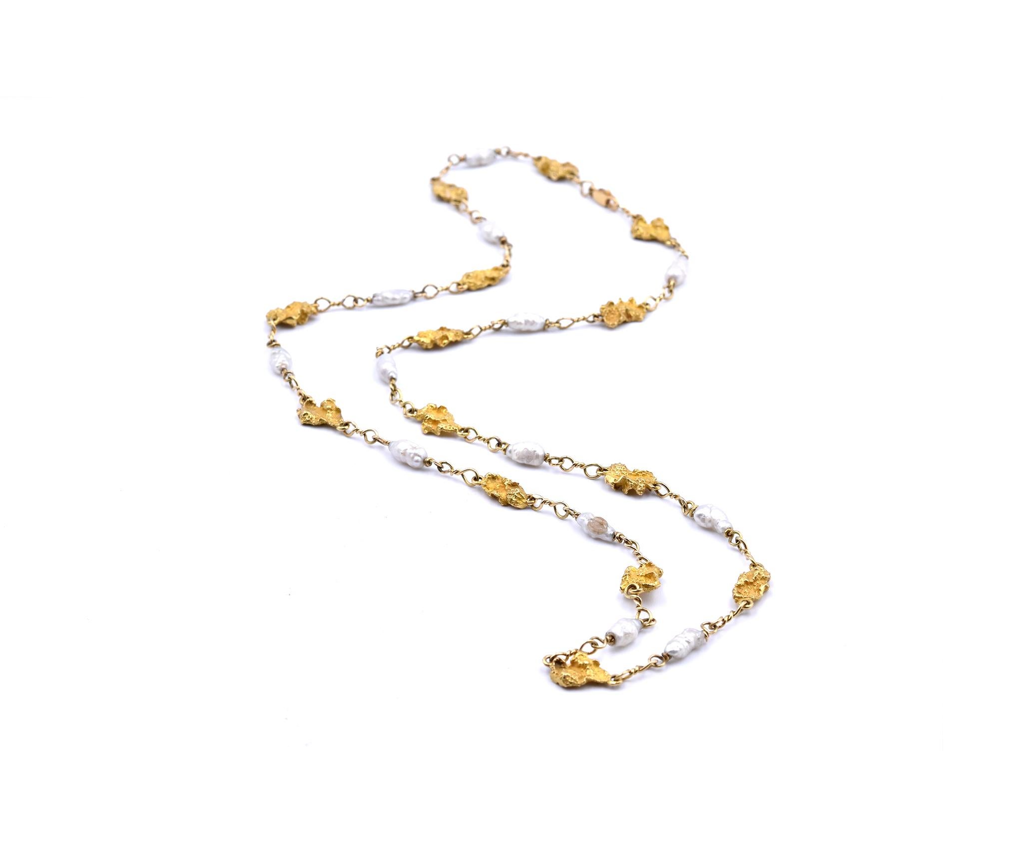Designer: custom design
Material: 18k yellow gold 
Dimensions: necklace is 22-inches long and it is 7.10mm wide at its widest point
Weight: 18.3 grams