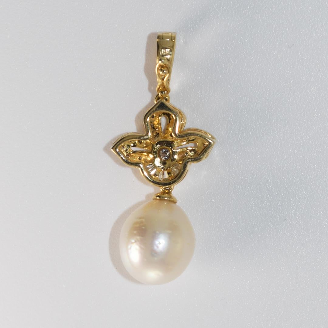 Pearl and diamond pendant in a yellow gold setting.
Stamped 18k, DO32.
Tests 71 % gold using an XRF metals analyzer.
The cultured pearl is slightly pear-shaped, white body color, has natural surface blemishes, 11mm diameter, and 0.32 total