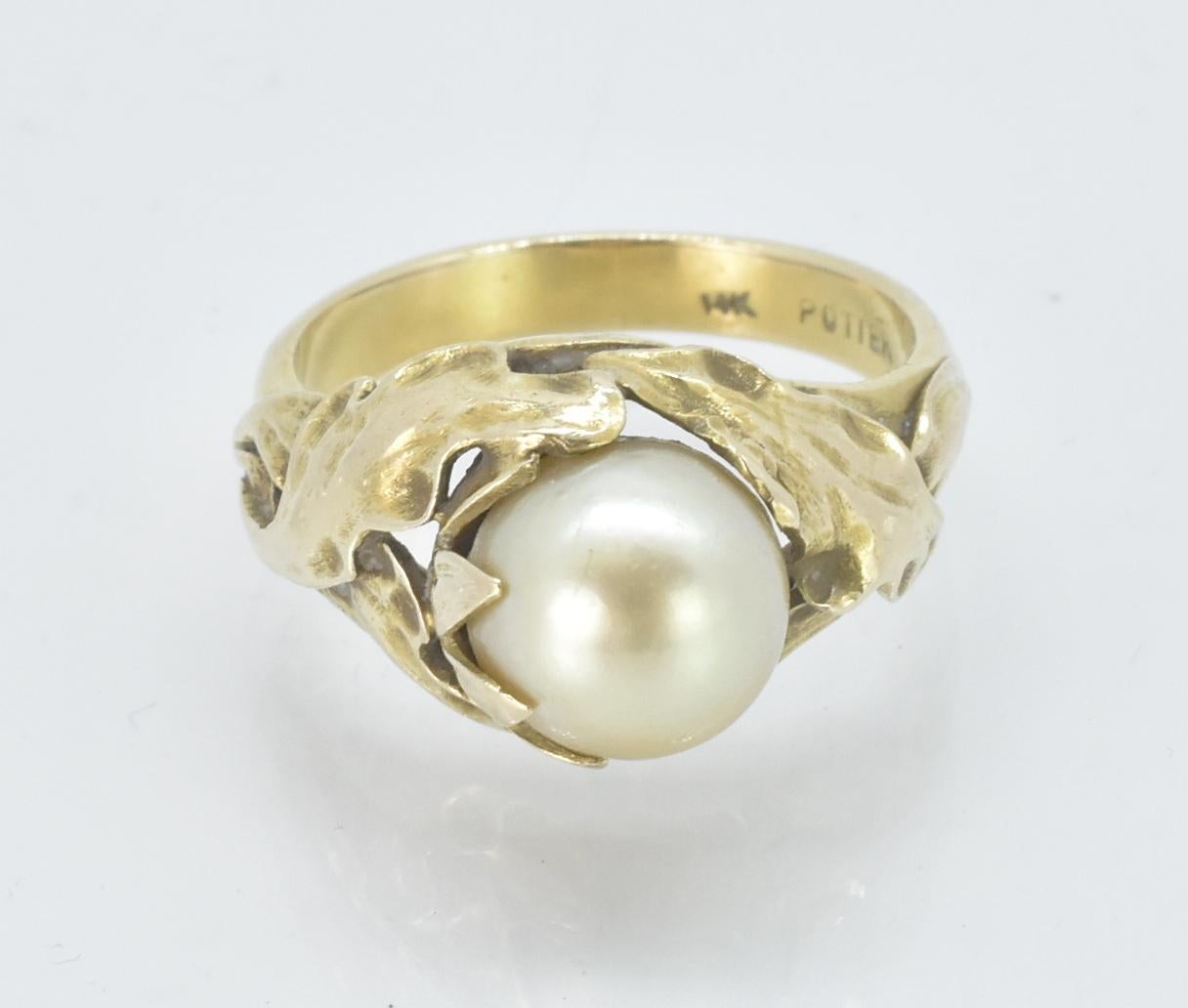 14K Yellow gold pearl ring by Potter & Mellon. 8.5mm Pearl organic form. 14K Yellow Gold with leaf design around the pearl. Ring size 7.25