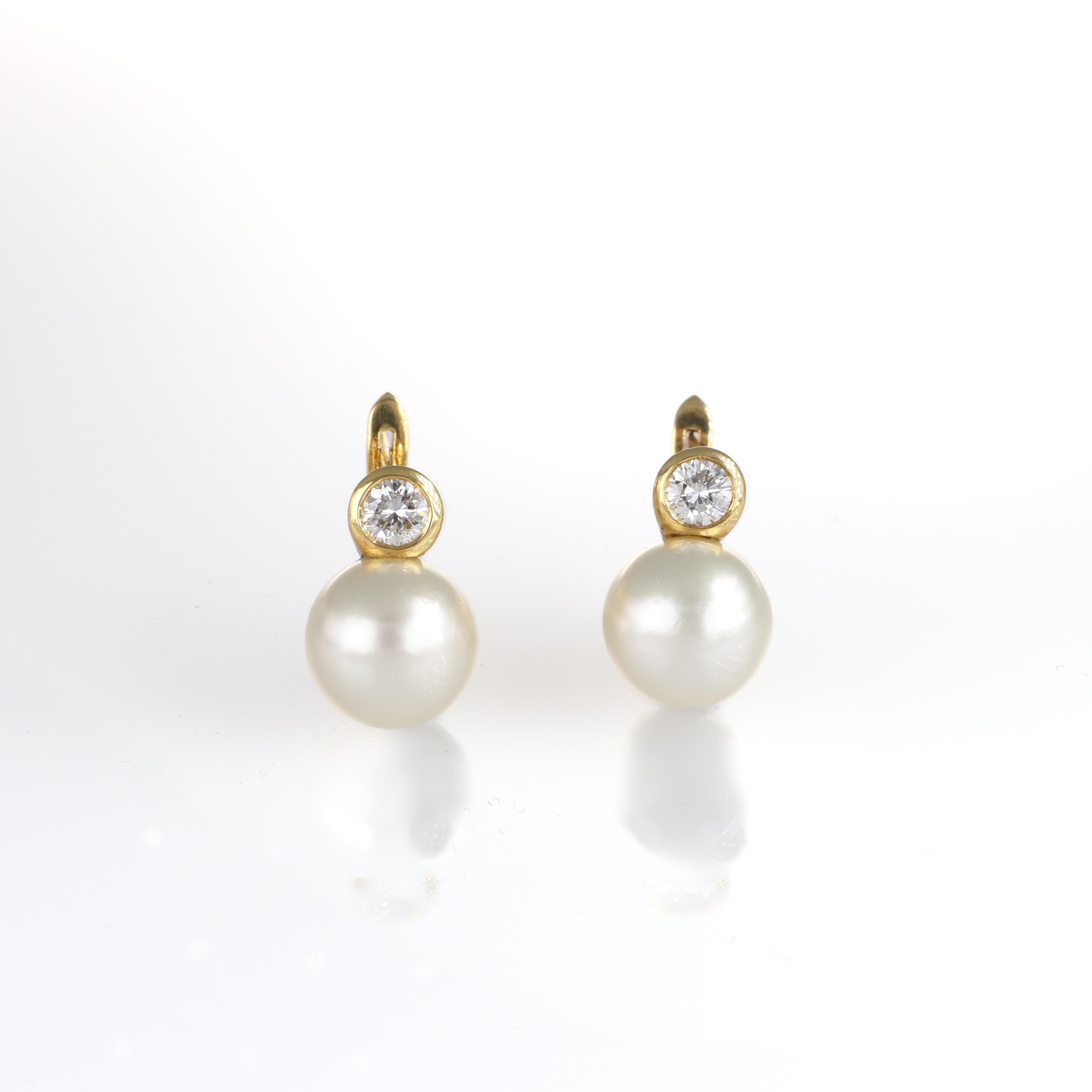 Timeless and refined, these stud earrings feature luminous pearls set in 18K yellow gold, each crowned with a brilliant-cut diamond solitaire. A perfect balance of sophistication and elegance, ideal for any occasion.

Key Features:

18K yellow