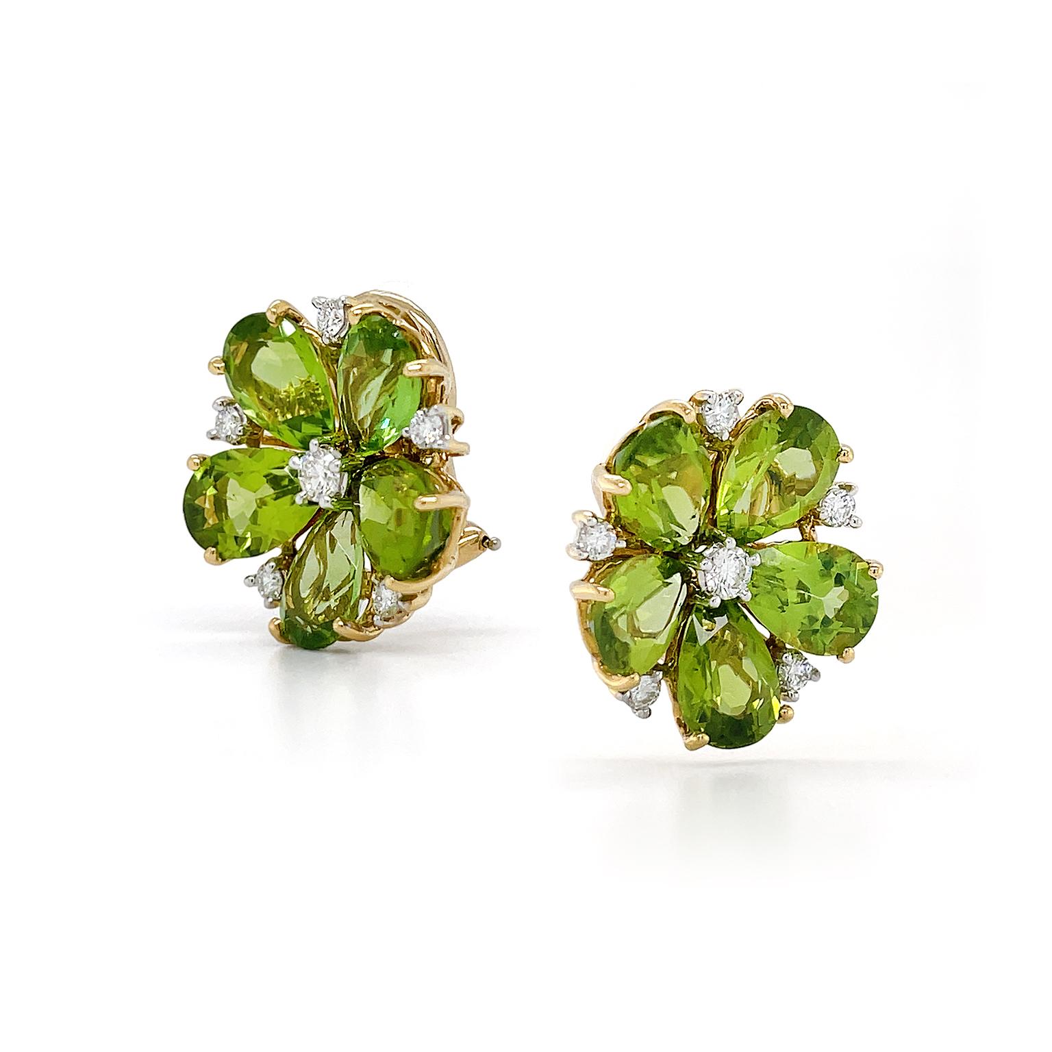 A jeweled pairing creates a bloomed flower. Light green and olive undertones shine in peridots in pear shapes. They are arranged with their tips inward, leading the eye to a single diamond in the center. At the outer part of the design, in between