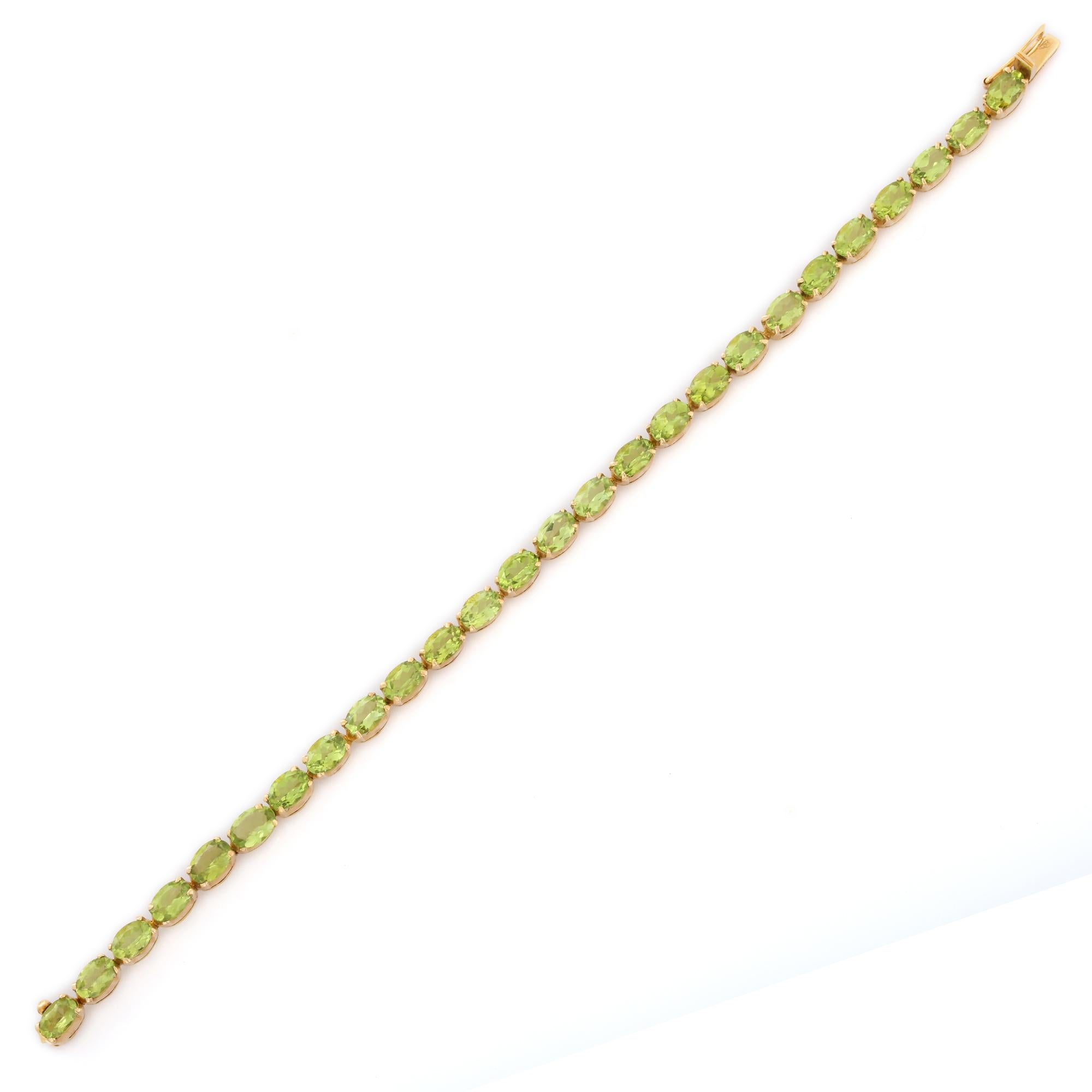 This Peridot Tennis Bracelet in 18K gold showcases 26 endlessly sparkling natural peridot, weighing 18.5 carats. It measures 7.25 inches long in length. 
Peridot attracts love and calms anger by giving renewal to all things.
Designed with perfect