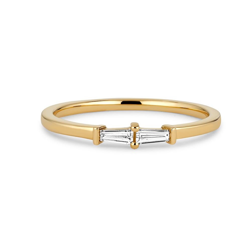 Elevate your everyday look with our 18K Gold Petite Double Baguette Diamond Stacking Band. This stunning ring is the epitome of accessible luxury, crafted from the finest materials and expertly designed to suit any occasion.

Featuring two striking