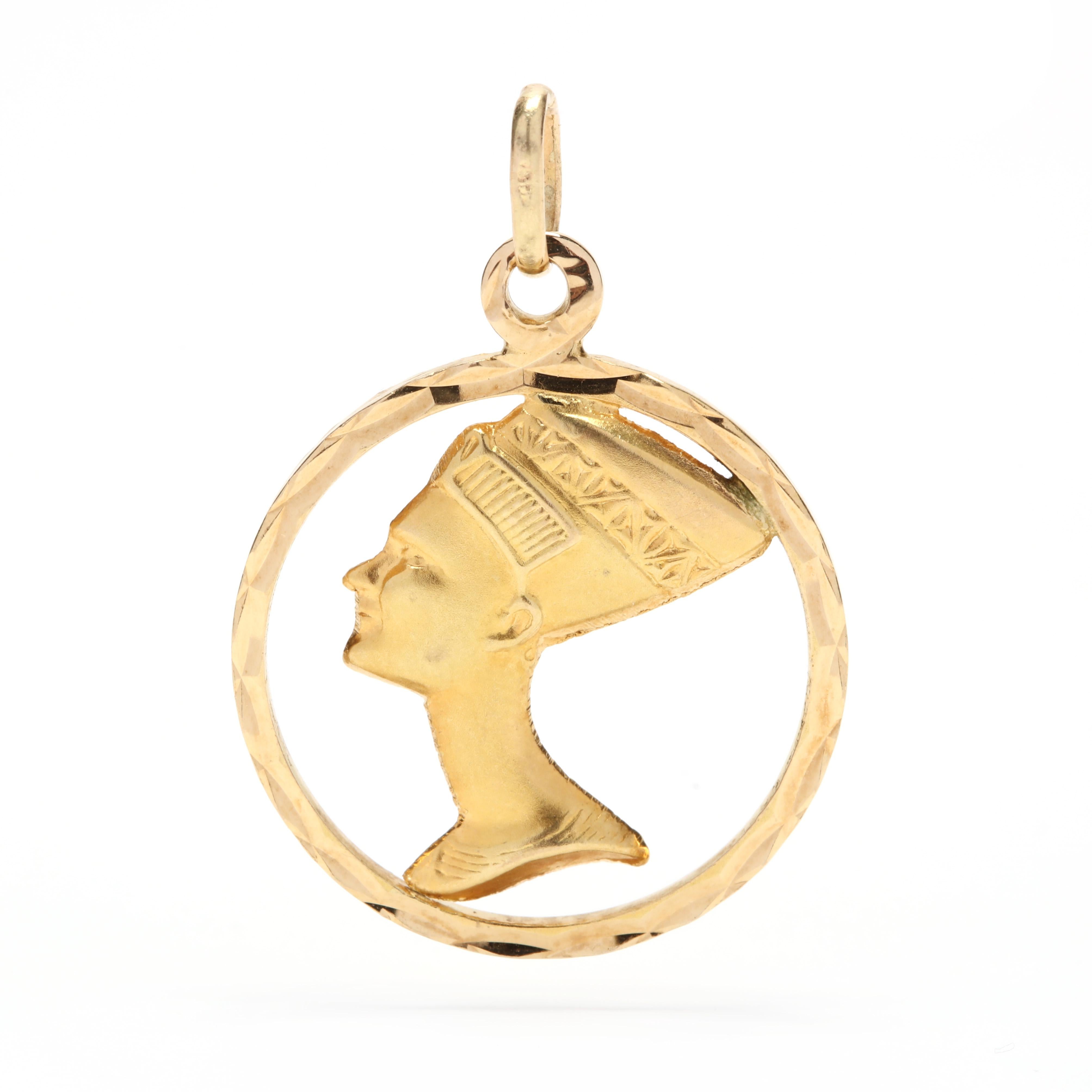 An 18 karat yellow gold Pharaoh Nefertiti round charm / pendant. This pendant features a faceted circle with a Pharaoh Nefertiti motif in the center.

Length: 1.25 in.

Width: 1 in.

2.54 dwts.

* Please note that this is a vintage item and may show