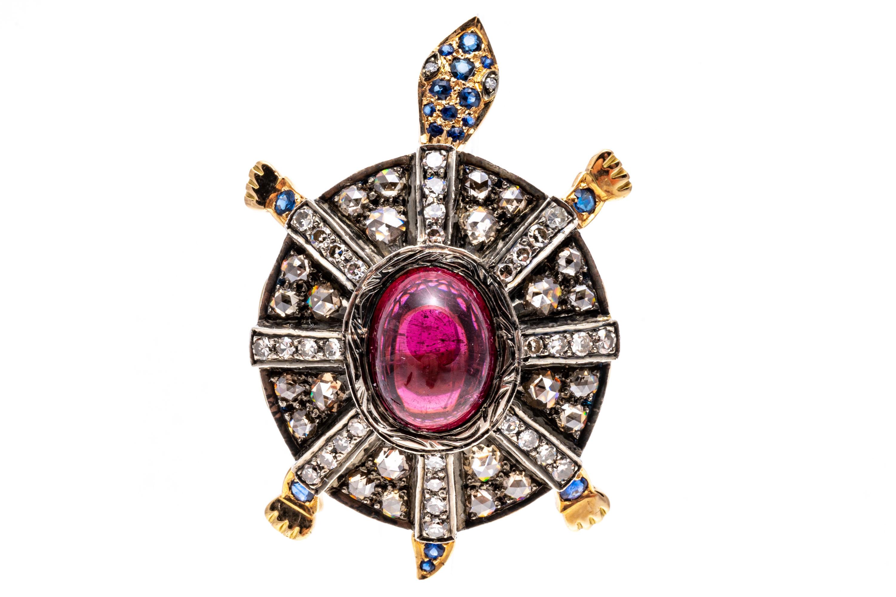 18k yellow gold ring. This stunning ring is a figural turtle ring, decorated on the back with a large, center oval cabachon, medium to dark pinkish red color tourmaline, approximately 4.01 CTS, bezel set and flanked by radiating rays of round