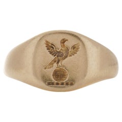 18K Yellow Gold Pinky Signet Ring: Bird with Spread Wings atop Globe Design