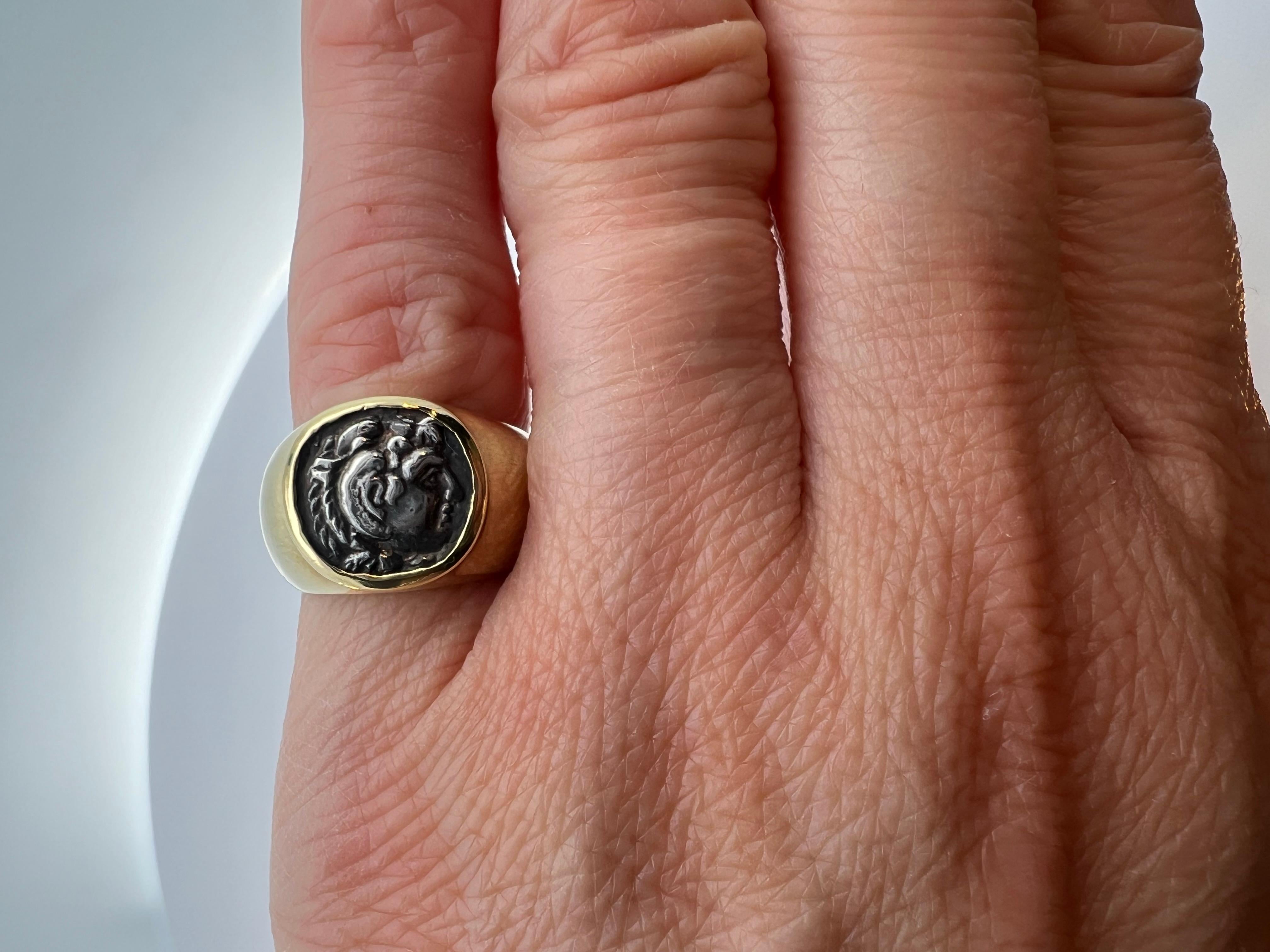 Elevate your style with the understated sophistication of this 18k yellow gold pinky signet ring, accented with a sterling silver coin. This exquisite piece is a fusion of classic elegance and contemporary flair, perfect for making a subtle yet