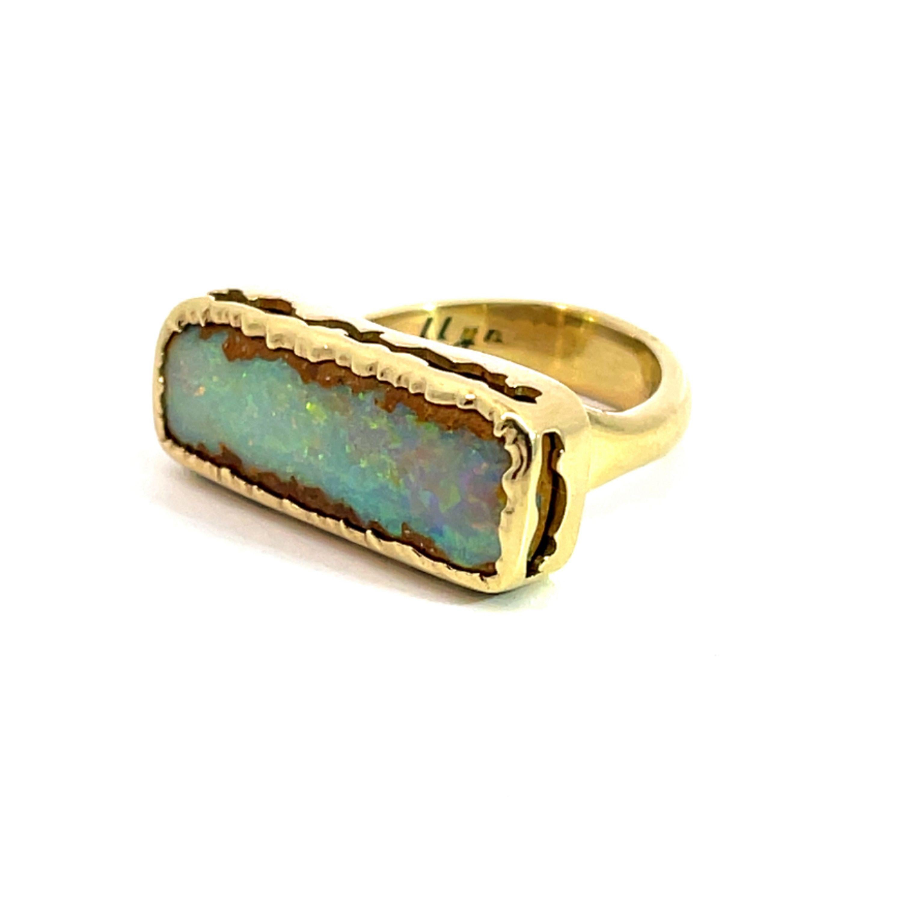 Contemporary 18k Yellow Gold Pipe Boulder Opal Ring For Sale