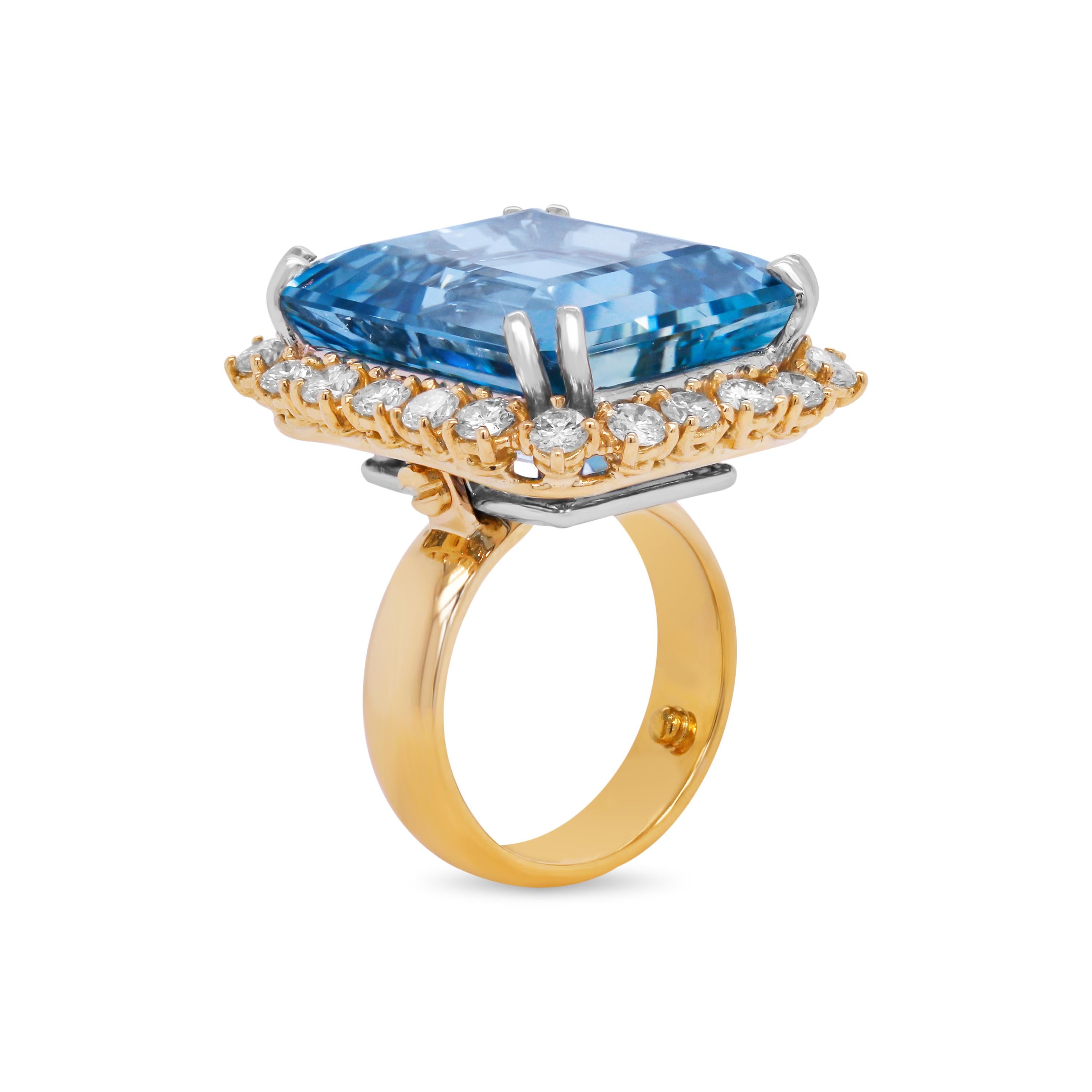 18K Yellow Gold Platinum Diamond 25 Carat Aquamarine Center Large Cocktail Ring

This one-of-a-kind ring features one of the most incredible Aquamarines we have laid our eyes in. At apprx. 25 carats, this is a large stone with lots of color and