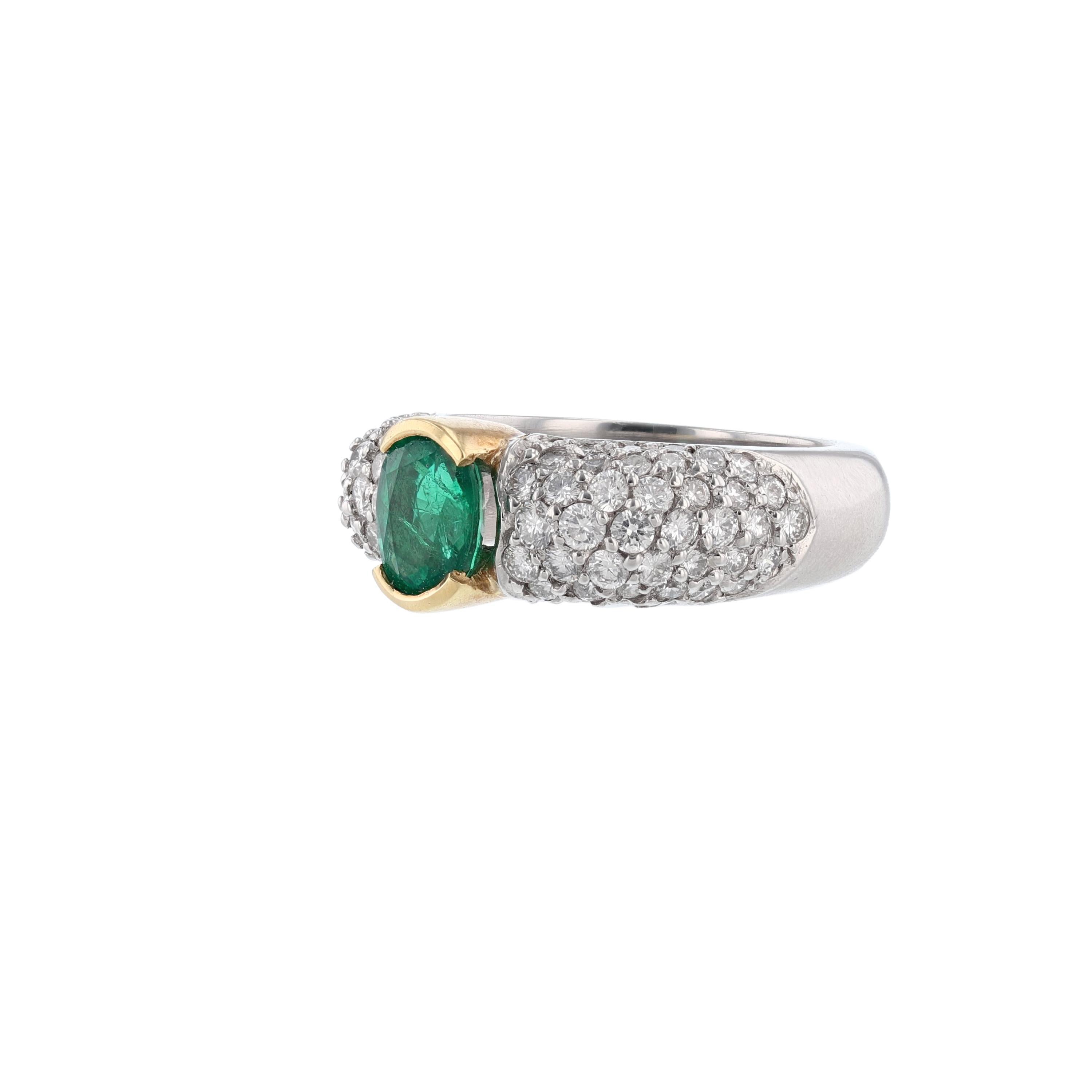This ring is made in platinum and 18K yellow gold. It features 1 oval cut, bezel set emerald weighing 1.21 carats. It also features 81 round cut, pave’ set diamonds weighing 1.54 carats.