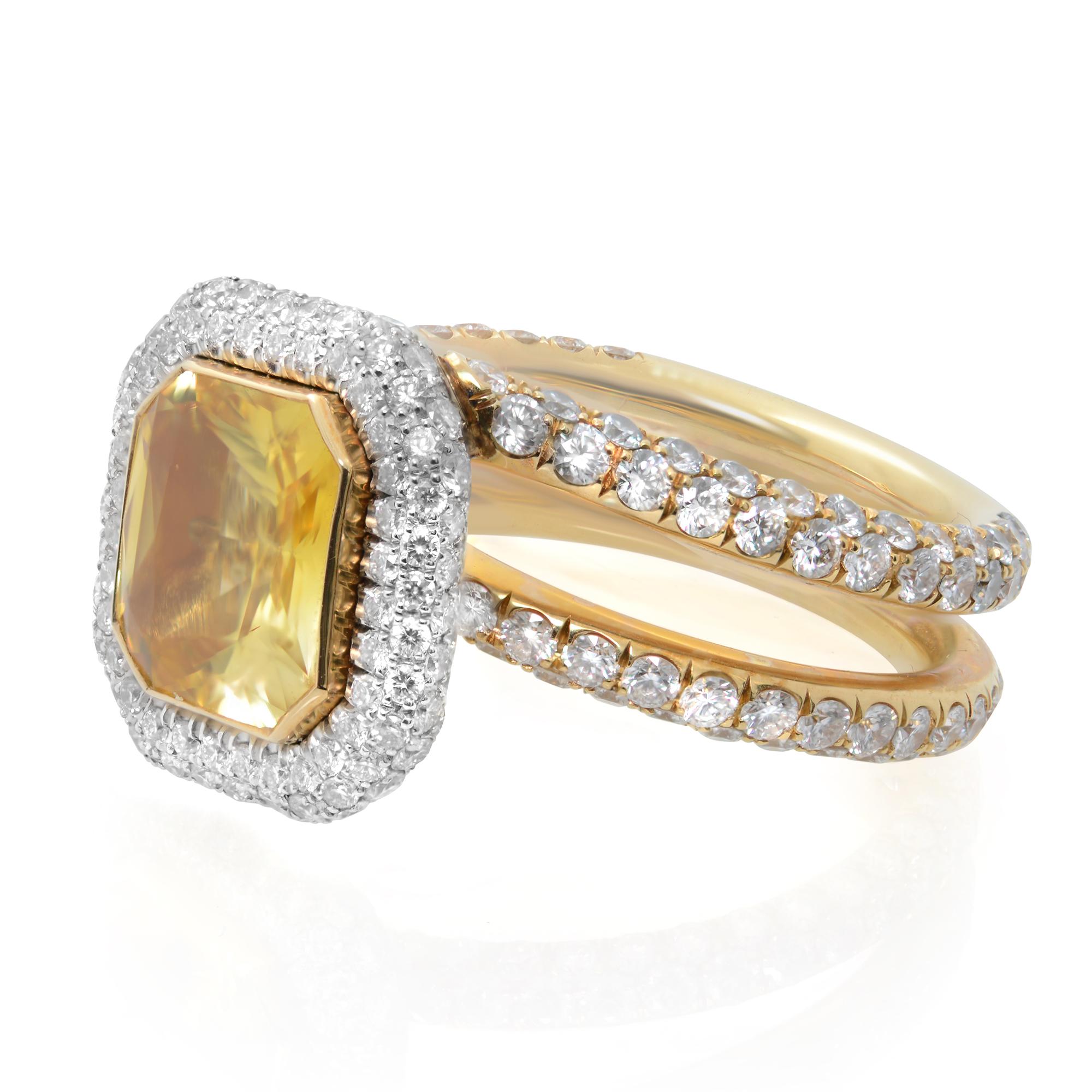 This is a gorgeous handmade custom natural yellow sapphire and diamond ring in 18K yellow gold and platinum. The center is a fancy radiant cut yellow sapphire weighting aprox. 3.00 carats. A diamond halo and Twisted Pavé Shank are totaling with 3.00