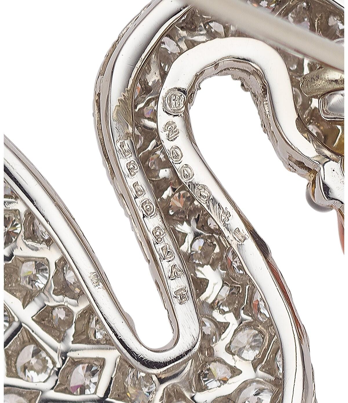 Gorgeous Platinum and 18k Yellow Gold Swan-Shaped Brooch With Diamonds by Oscar Heyman & Brothers.
Total Carat Weight = Appx 7.60 ct
Average Diamond Color: G-H-I.
Average Diamond Clarity: VS.
Also Features a Cabochon Shaped Ruby.
Dimensions: 2 in. x