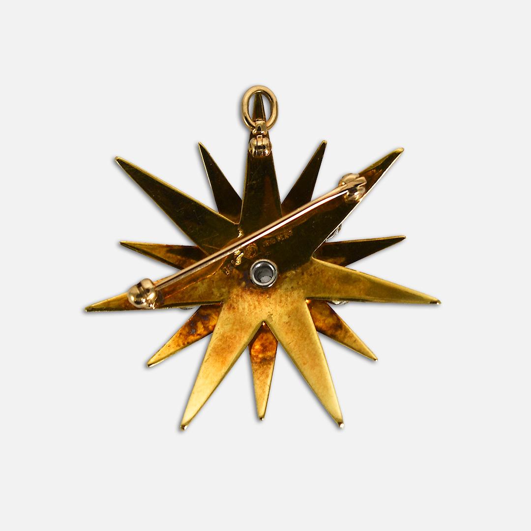 Vintage 18k yellow gold, platinum, and diamond brooch.
Starburst Design.
Stamped 18k, Plat, Irid, and weighs 15 grams gross weight.
The diamonds are round brilliant cuts,  approximately 2.50 total carats, G, H, I color range, Vs clarity.
The