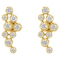 Pendientes en cascada con diamantes redondos engastados con garras en oro amarillo de 18 quilates
