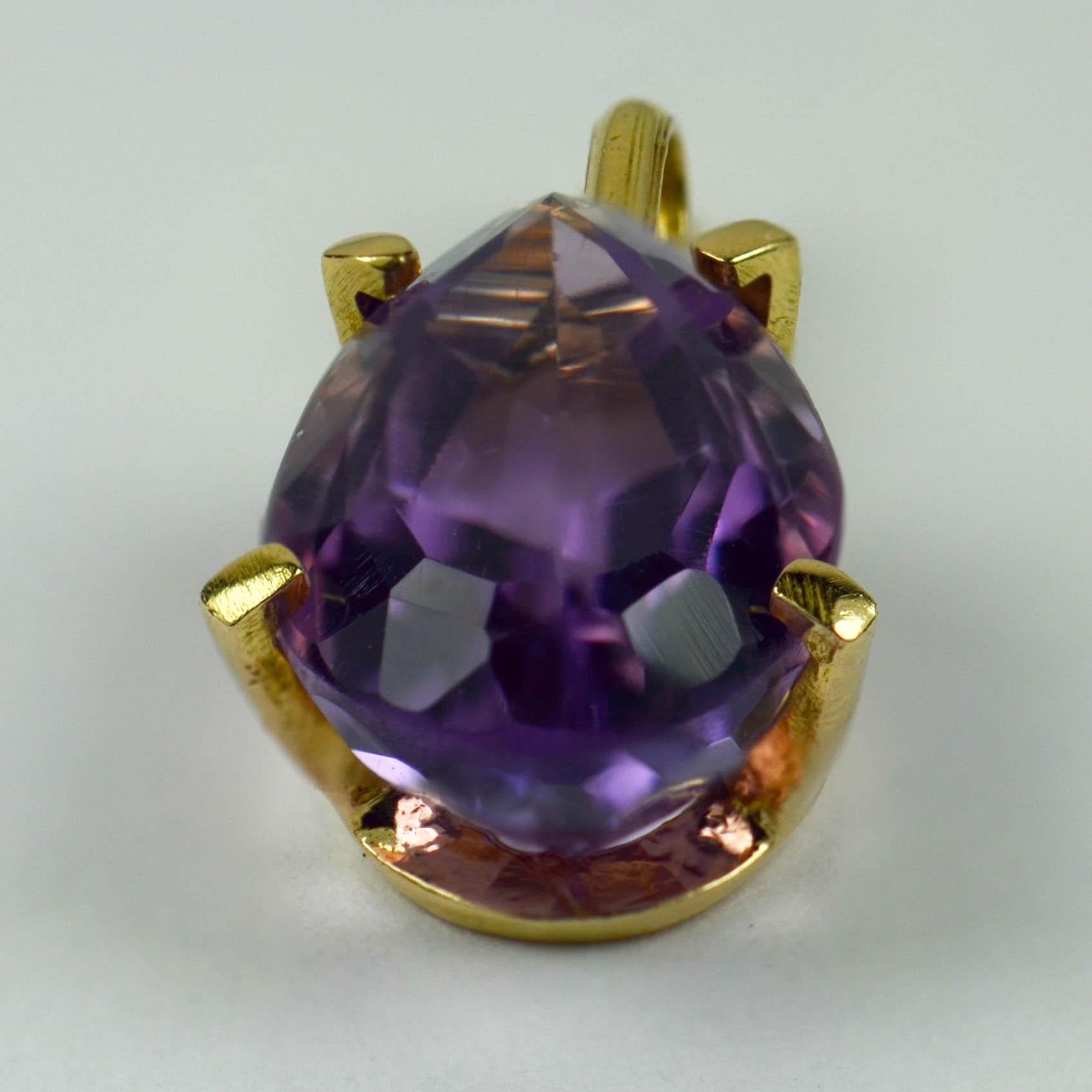 An 18 karat (18K) yellow gold pendant set with a pear shape purple amethyst with an approximate weight of 5.34 carats. Stamped for 18 karat gold.

Amethyst dimensions: 15.08 x 9.37 x 7.13mm, calculated to weigh 5.34 carats.
Dimensions: 2.4 x 1.2 x