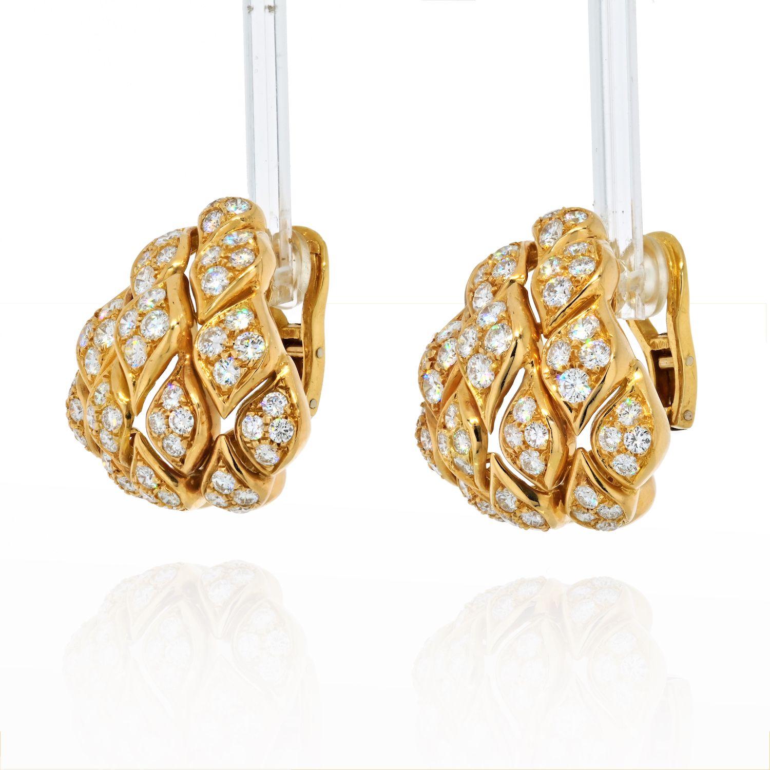 These vintage 18k yellow gold ear clips were made in France and boast a geometric form set with pave round cut diamonds. 

Extra coverage for your ears! Rest assured these are show-stopping ear clips. 
Weighing in total approximately 8.00 carats of