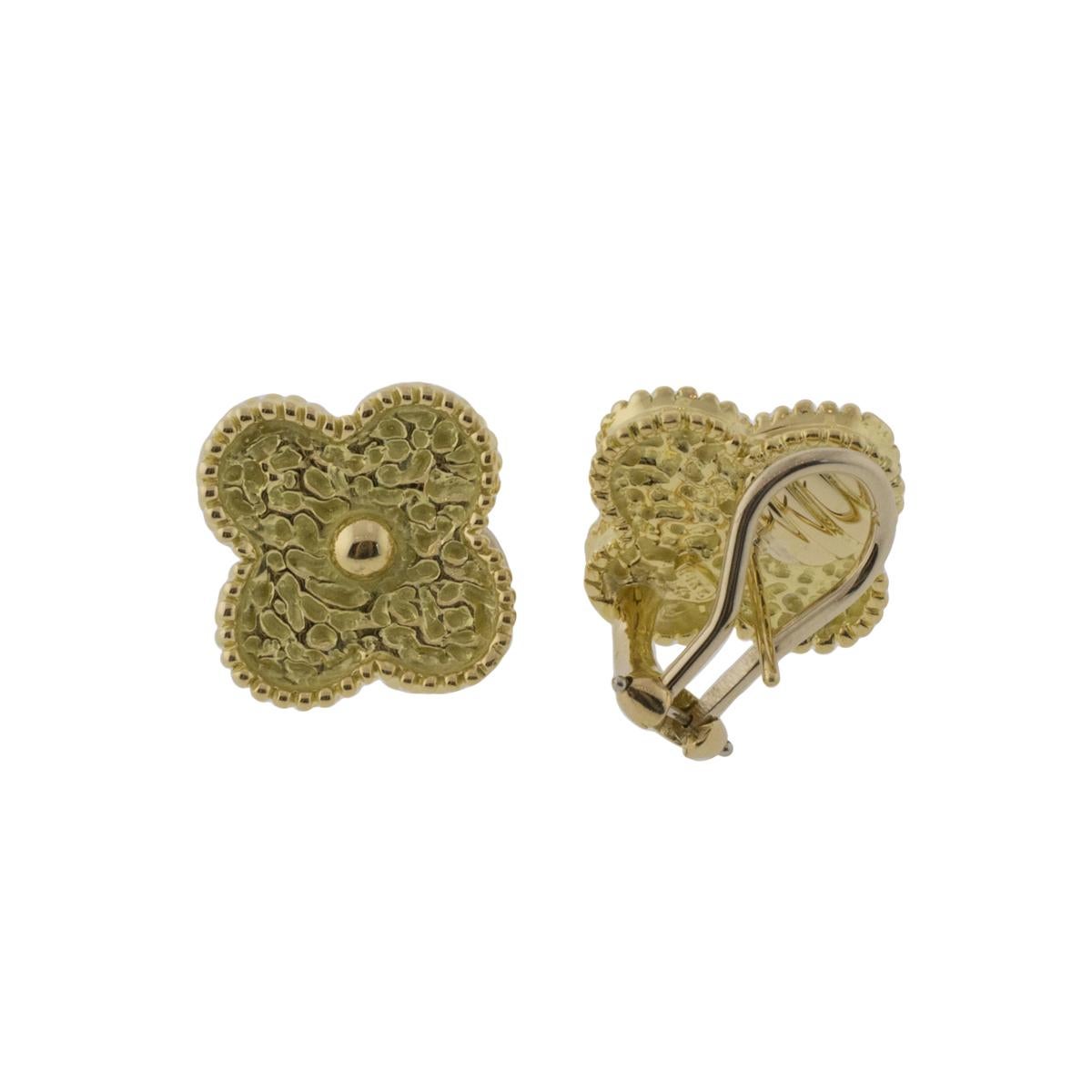Experience the timeless beauty of these 18k yellow gold quatrefoil lever back earrings. Delicate yet durable, the textured floral design on these 15mm wide earrings will ensure you stand out. A charming classic for any collection! This estate