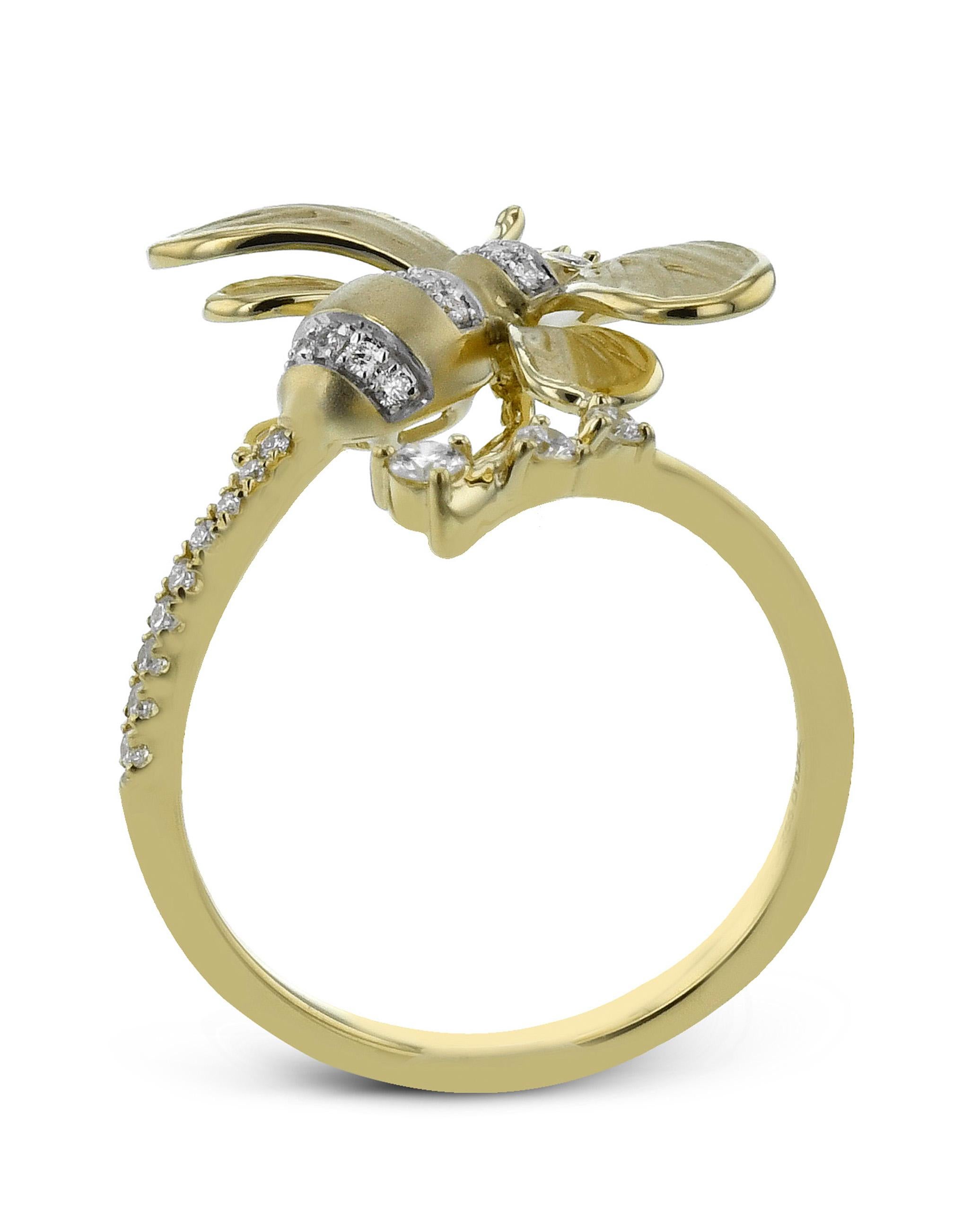 18K yellow gold queen bee wrap around ring by Simon G. The ring is made of 18K yellow gold and furnished with 24 round diamonds 0.22 carat and 2 round emeralds 0.02 carat.

- Finger size
- Diamonds are G color, VS clarity.