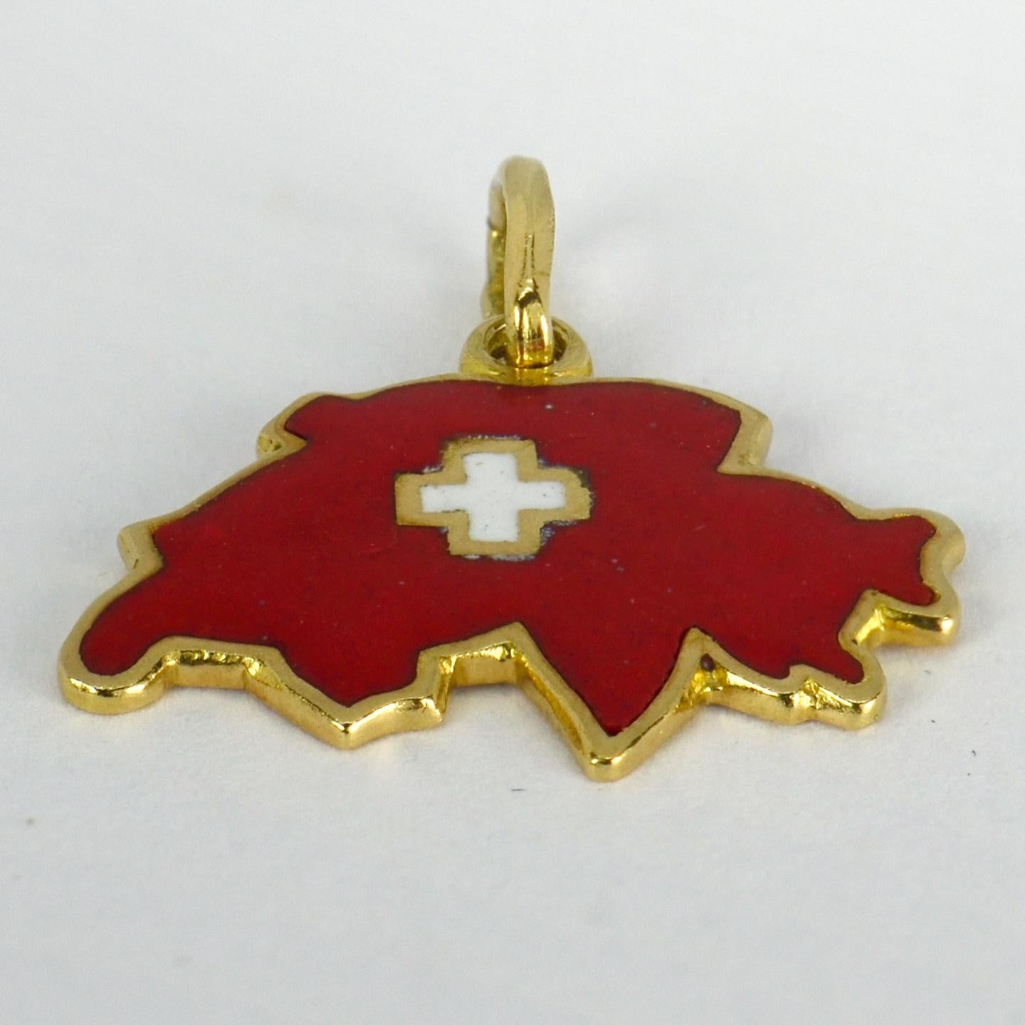 An 18 karat (18K) yellow gold charm pendant designed as a map of Switzerland with white and red enamel. Stamped 750 for 18 karat gold.

Dimensions: 1.1 x 2.1 x 0.1 cm (not including jump ring)
Weight: 2.31 grams

