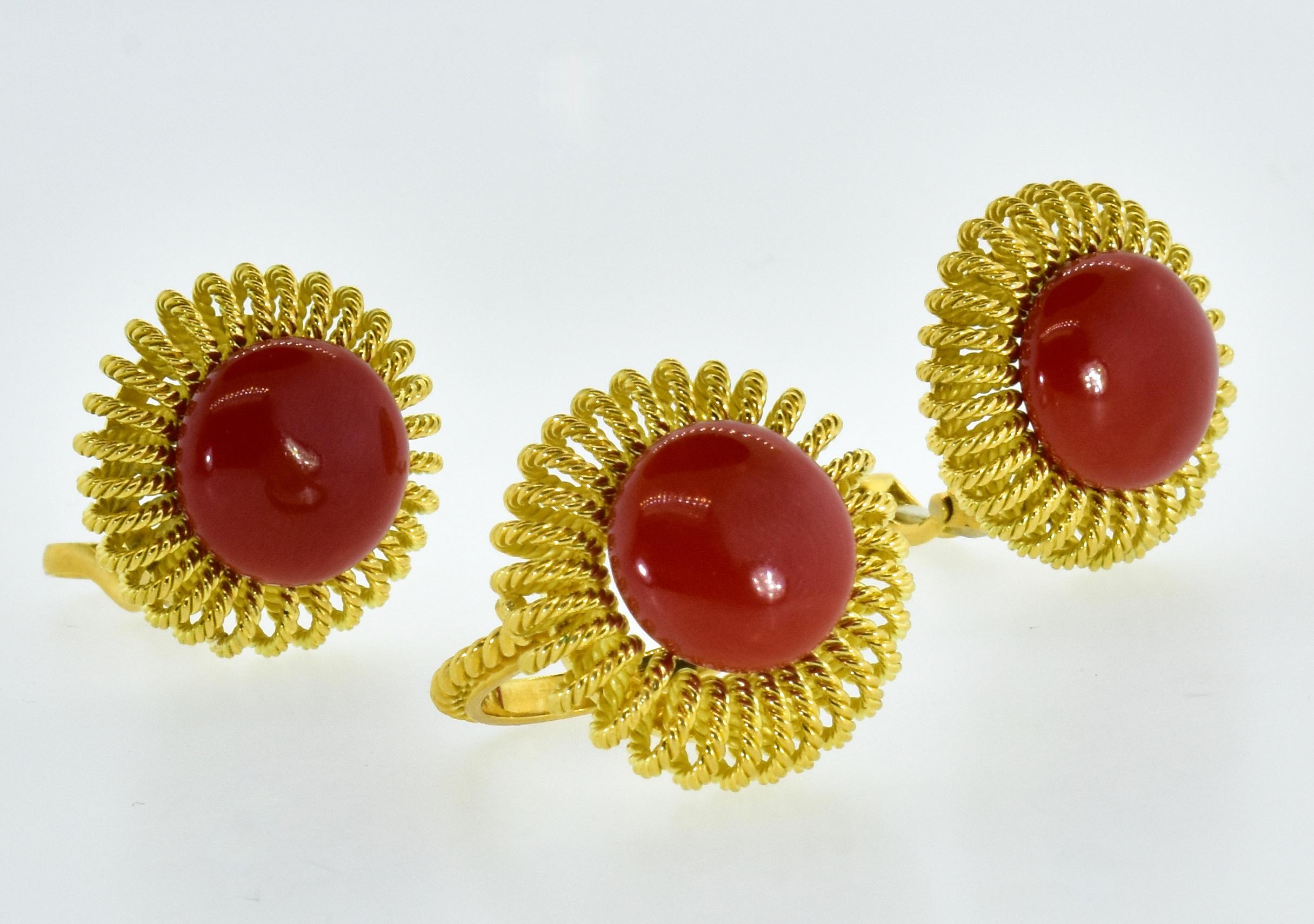Vintage suite of fine natural oxblood red coral earrings and matching ring all in 18K.  This unusual and rare suite of oxblood coral ring and earrings is circa 1950.   The earrings:  from deep, likely Mediterranean waters comes an excellently