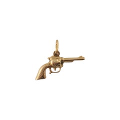 Breloque pistolet à canon tournant en or jaune 18 carats