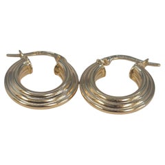 Orecchini Huggie Hoop a coste in oro giallo 18K #23535