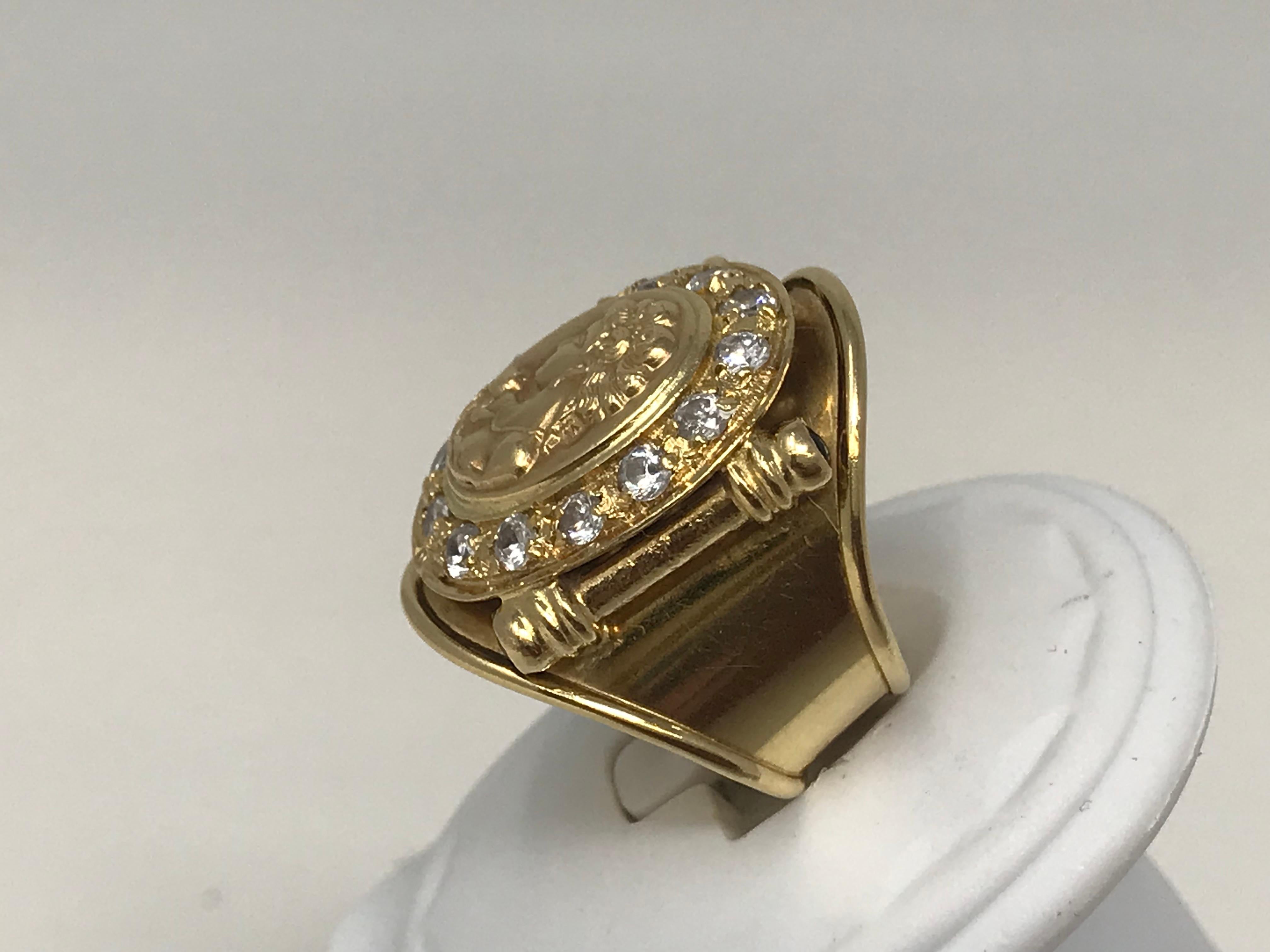 18K Yellow gold ring, size 8.5 ( 58.3 )adjustable, showing a cameo woman head surrounded by crystal stones, made in Egypt circa 1980 stamped inside and on the top, pre owned, weight 12 gr.