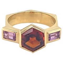 Sechseckiger Ring aus 18 Karat Gelbgold mit Spessartit ''Oranger Granat'' und rosa Turmalin