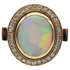 Anillo de oro amarillo de 18k Ópalo y diamantes talla brillante