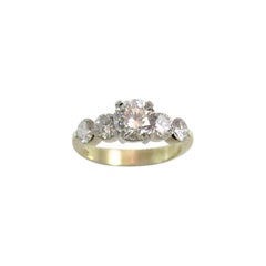  18K Yellow Gold Ring Set with 1.06ct Full Cut Round Diamond and 4 Side Stones