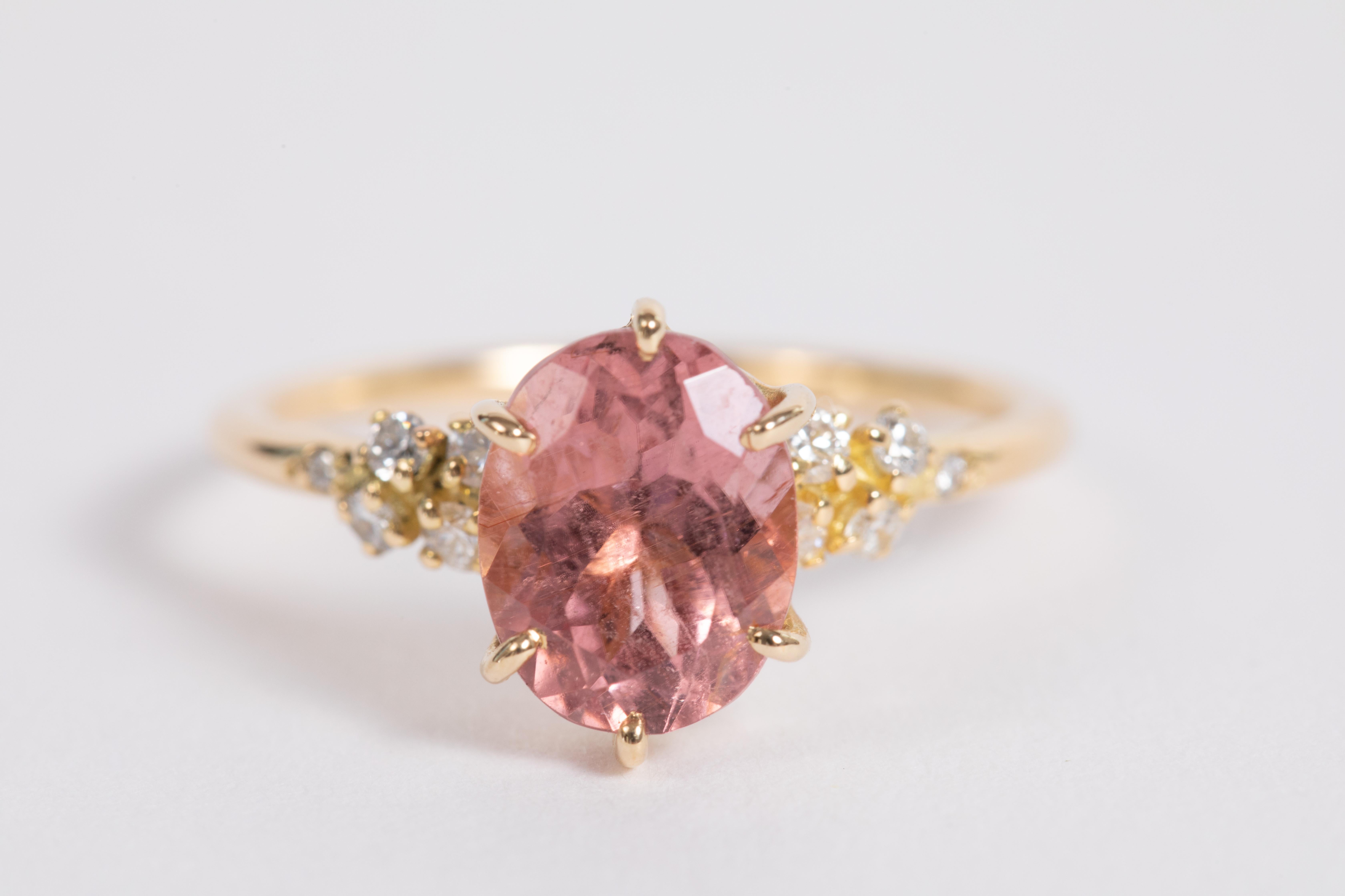Made of 18K yellow gold, this charming and delicate ring is set with a pink tourmaline ovale and white diamonds on the mount.
Ring total weight : 2,70 g
Pink tourmaline weight : 2,01 carat
Diamonds weight : 0,16 carat

Unique piece, Size  US 6 1/2