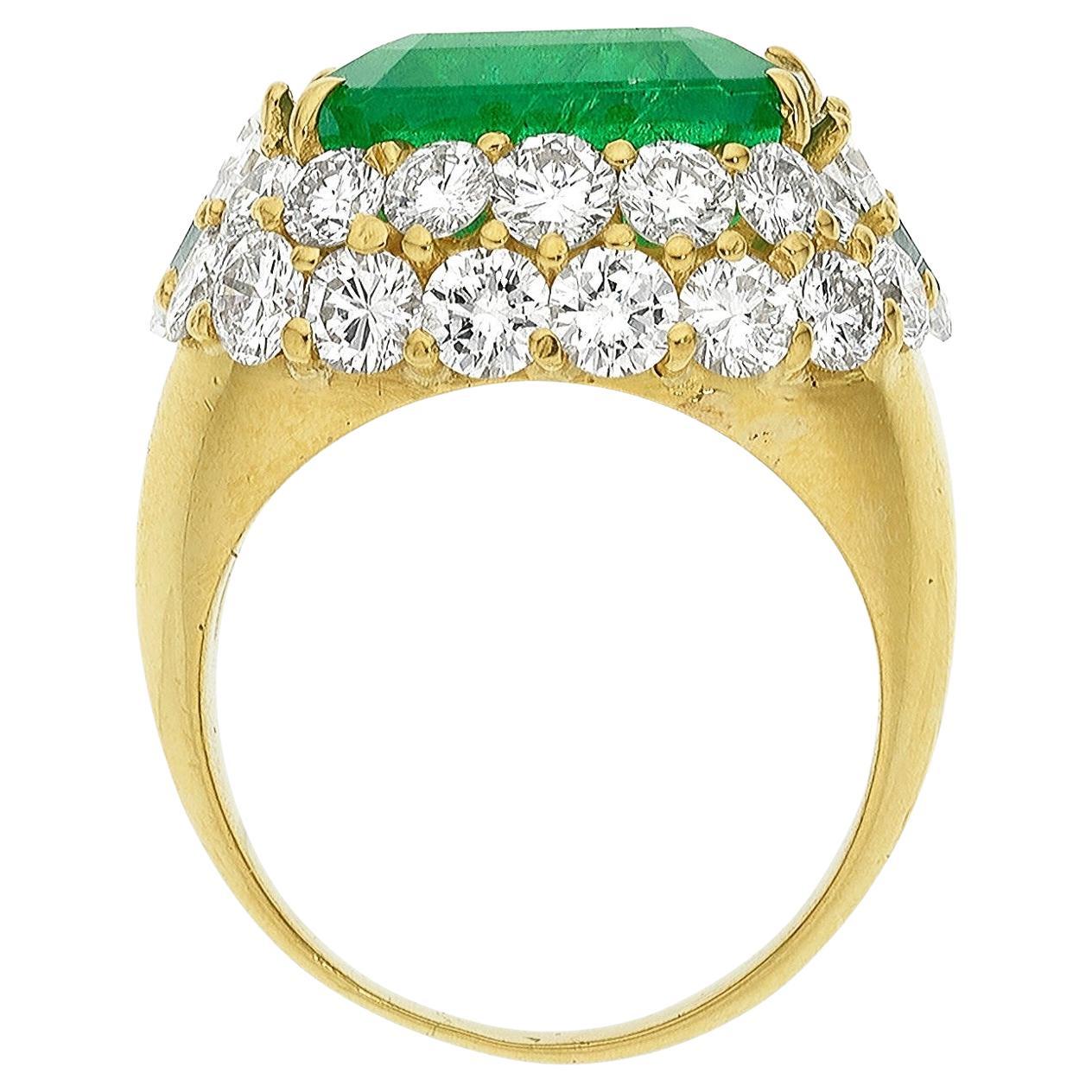 Beautiful 18k Yellow Gold Ring With a Stunning Emerald and Diamonds.
Size 8.
Features a 10.28 Carat Emerald-Cut Emerald as the Center Stone.
Accented by ~2.25 Carats of Full-Cut Diamonds and ~0.50 Carats of Triangular-Shaped Diamonds. 
Emerald