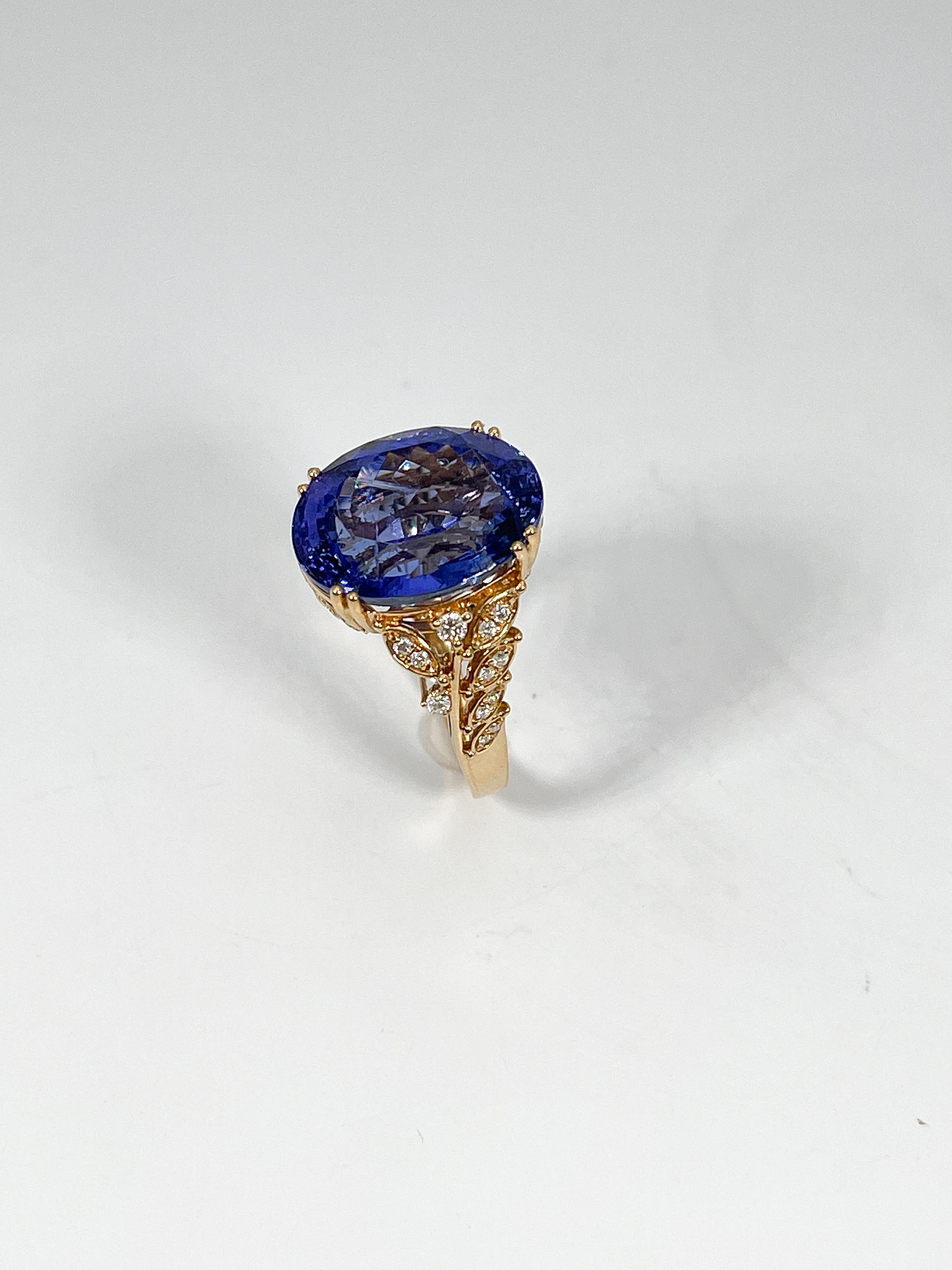Oval Cut 18K Yellow Gold Ring with 13.94 CT Tanzanite and .28 CTW Diamonds For Sale