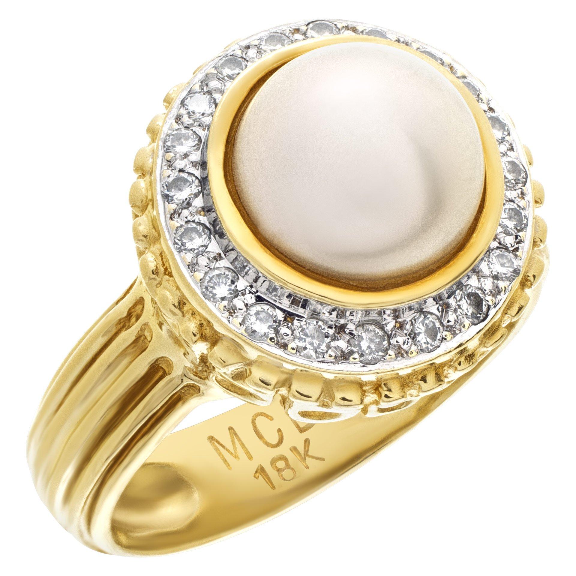 Pretty golden overtone 8.2mm pearl ring in 18k yellow gold with diamond halo, approxiamtely 0.40 carats in diamonds. Size 6.5.

This Pearl/diamond ring is currently size 6.5 and some items can be sized up or down, please ask! It weighs 6.9