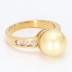18k Yellow Gold Ring with a Yellow Pearl & Channel Set Diamond Accents - 6.25