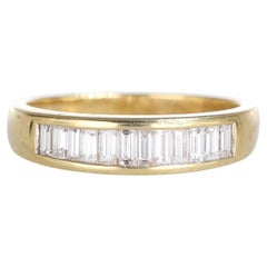 Anello in oro giallo 18K con diamanti taglio baguette
