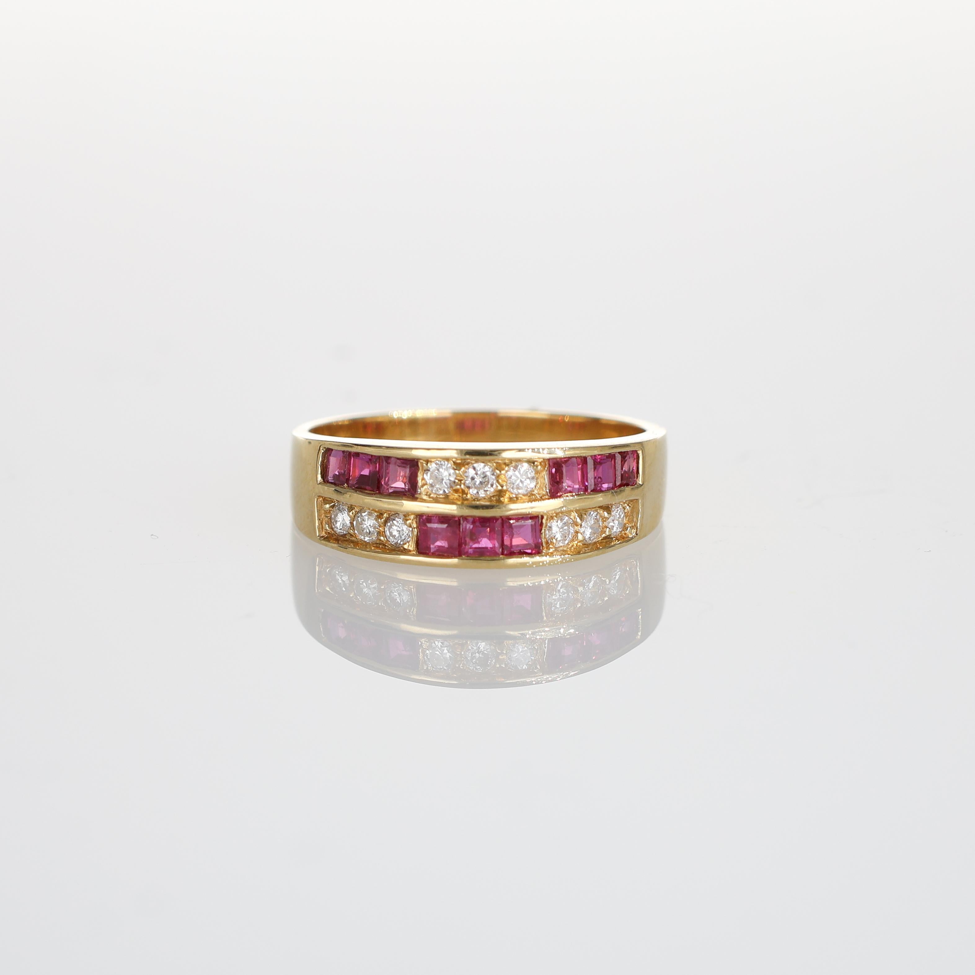 This exquisite 18k yellow gold ring features a striking design with carre-cut rubies and brilliant-cut diamonds arranged in a checkerboard pattern. The vibrant rubies and dazzling diamonds create a harmonious and luxurious composition, perfect for