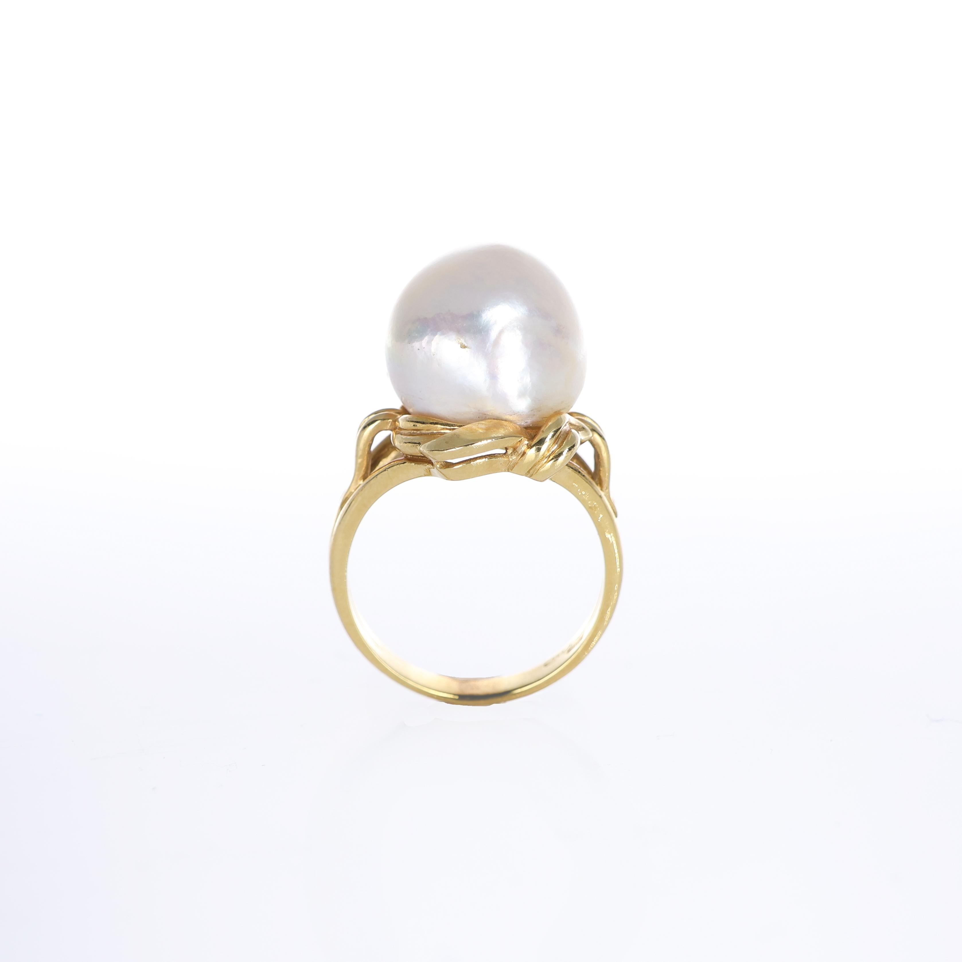IMPORTANT NOTE:
✔ No additional costs will be added to this order.
✔ Shipping and customs duties are fully covered by us.
--------------------
A striking ring crafted in 18K yellow gold, featuring an irregular central pearl. The unique organic shape