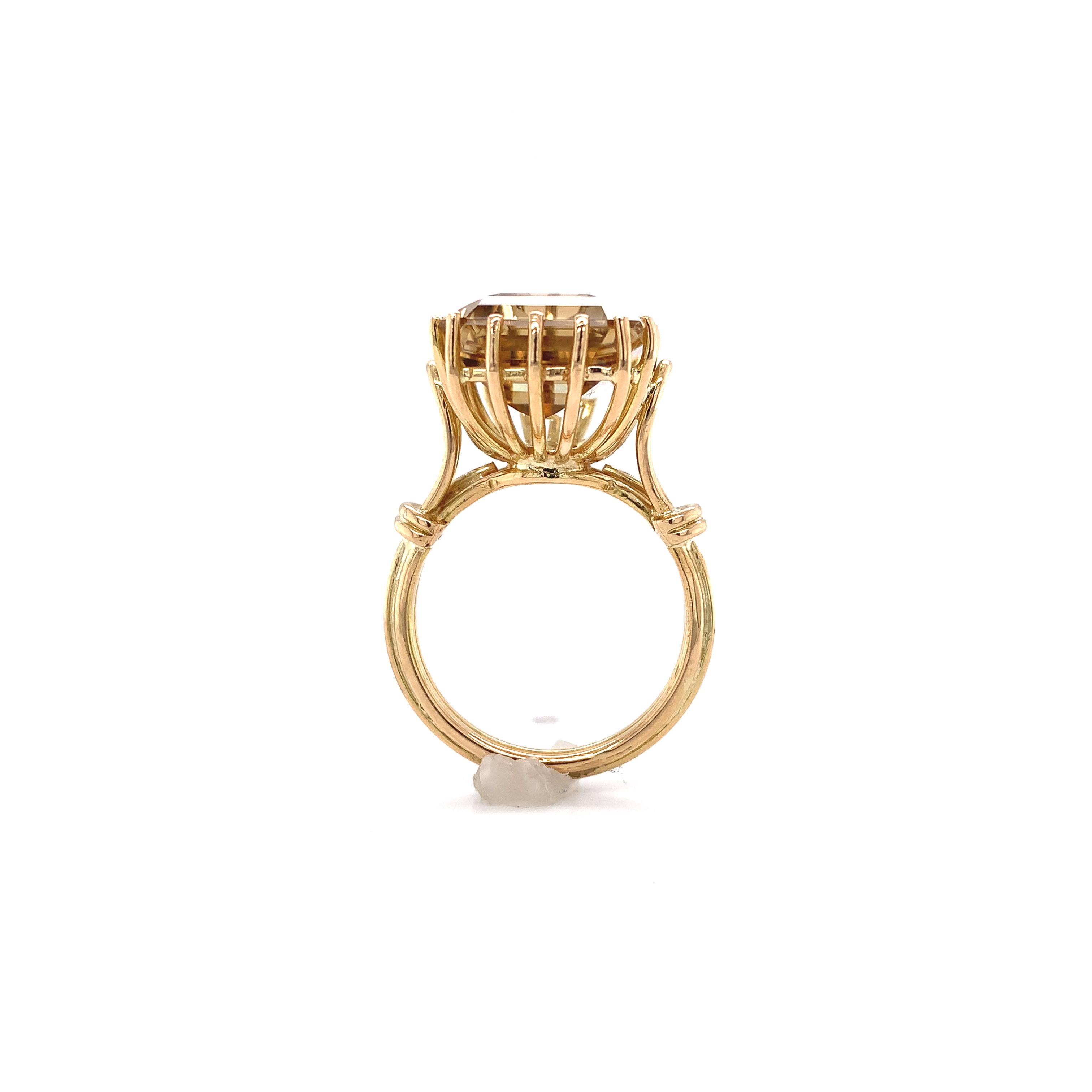 18K yellow gold vintage ring with the original large smoky/champagne quartz stone. The quartz is a large emerald cut measuring about 15.5mm x 12mm with light golden tan color. The mounting is hand made from gold wire. The ring fits a size 6 finger