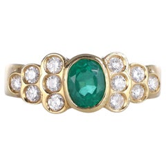 18k Yellow Gold Ring with Oval Emerald and Diamonds