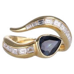 Anello in oro giallo 18k con zaffiro taglio pera e diamanti Baguette