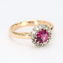 Anello in oro giallo 18k con granato rodolite centrale e diamante a raggiera - misura 6,75