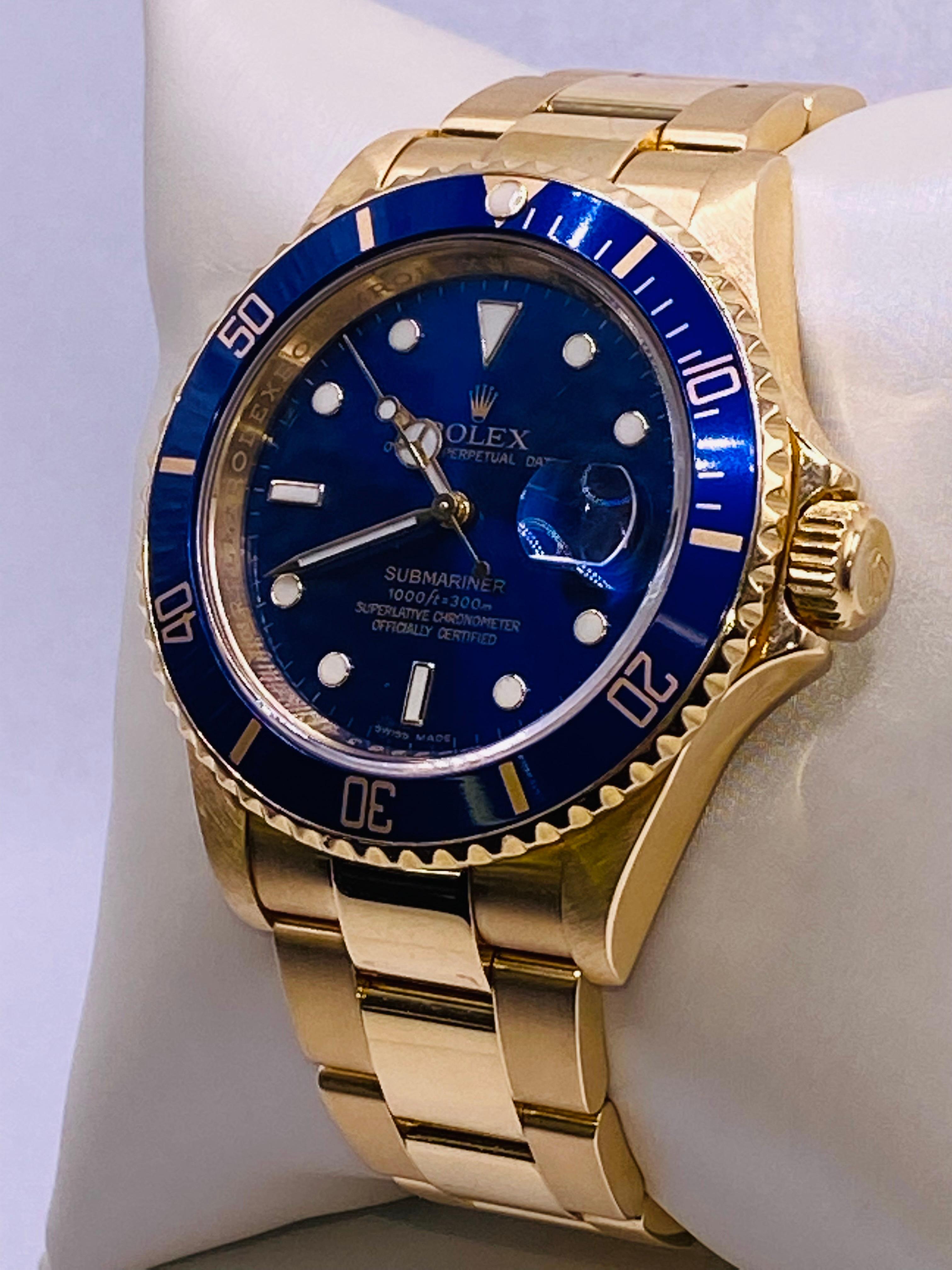 18k Yellow Gold Rolex Submariner Blue Dial. Year: 2007 / 2008 Style: 16618 Serial: M089834. 
