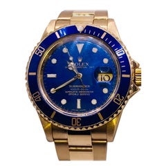 or jaune 18k Rolex Submariner cadran bleu